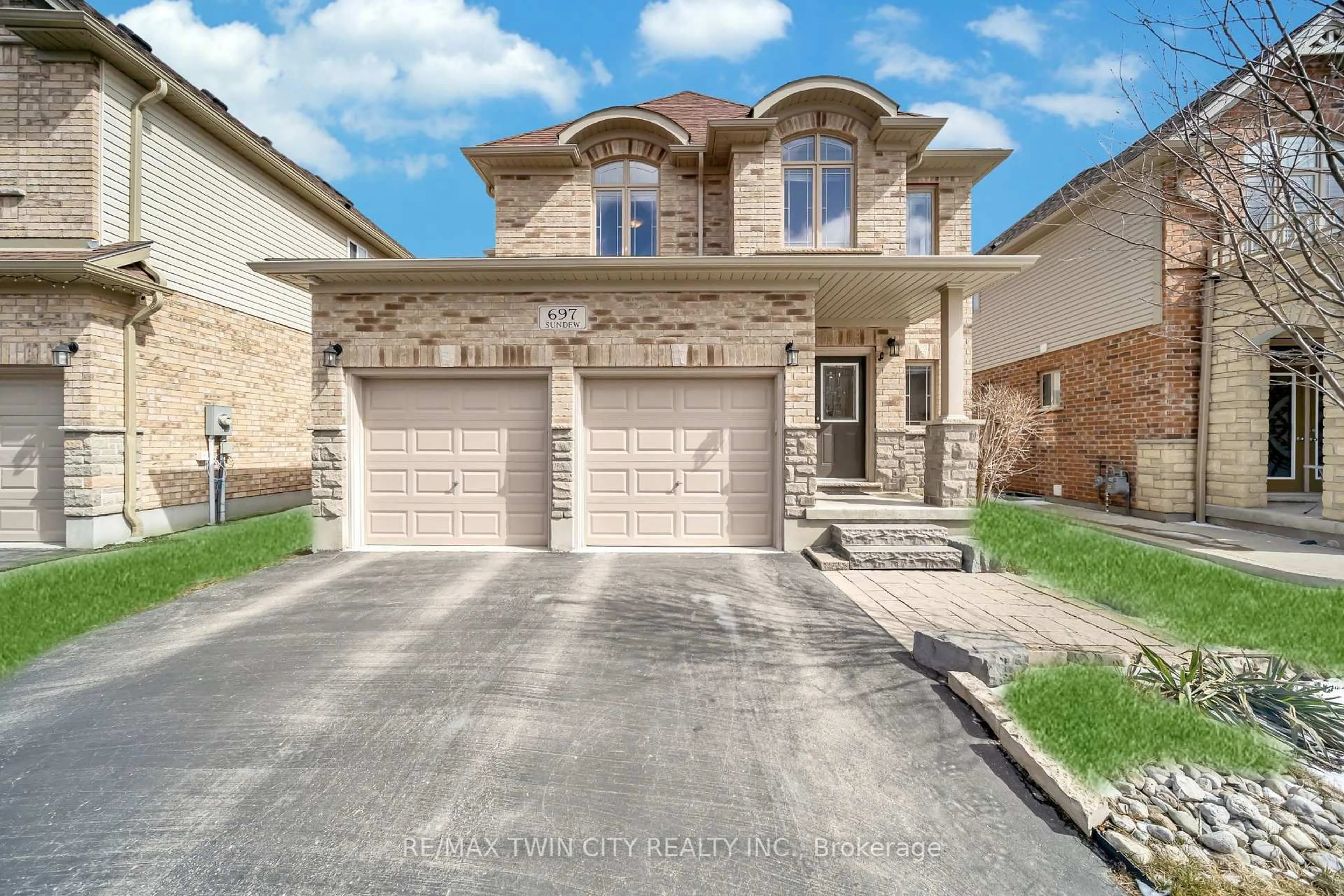 Home with brick exterior material, street for 697 Sundew Dr, Waterloo Ontario N2V 0E4