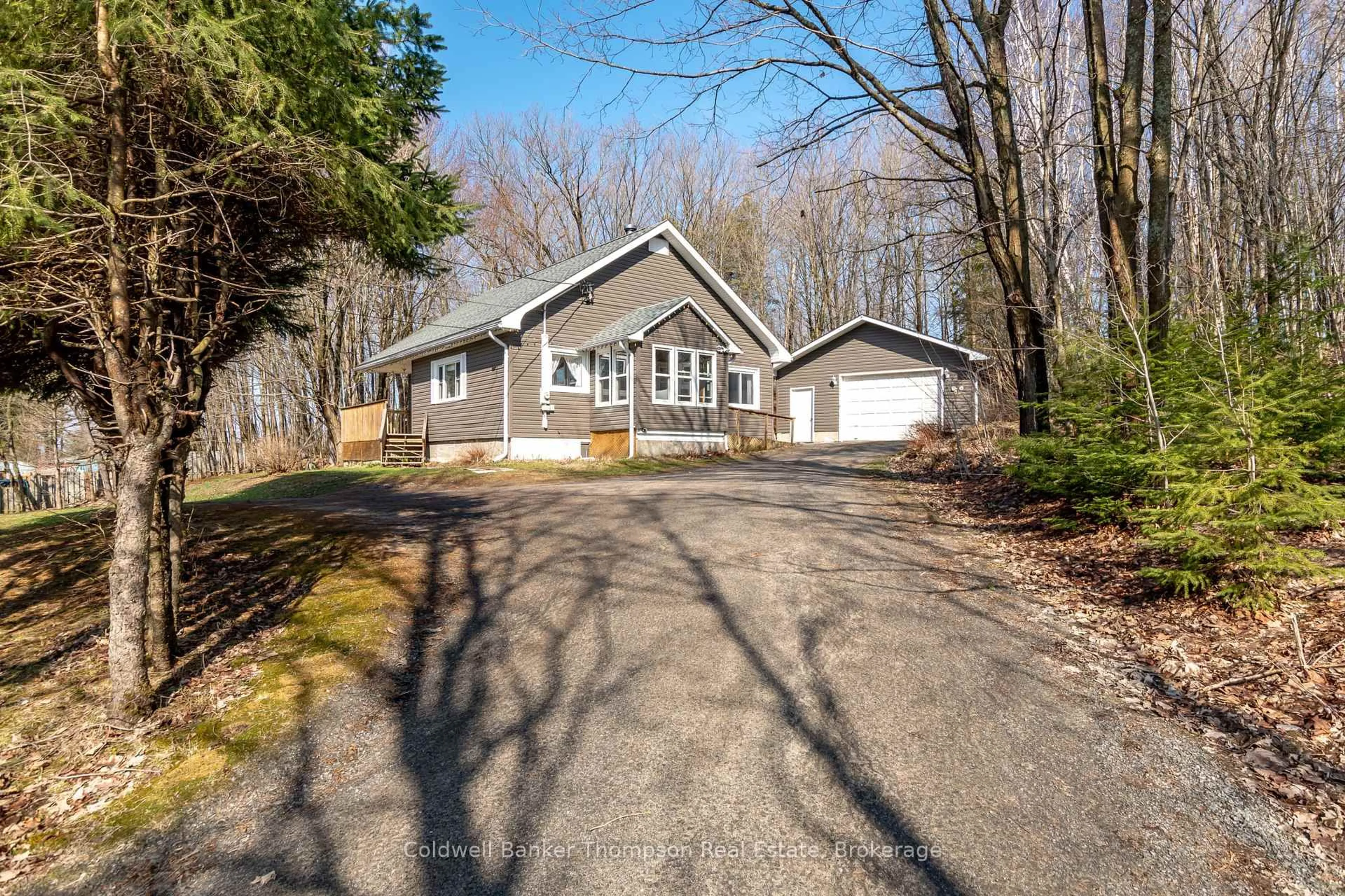 A pic from outside/outdoor area/front of a property/back of a property/a pic from drone, unknown for 66 Hanes Rd, Huntsville Ontario P1H 1M3