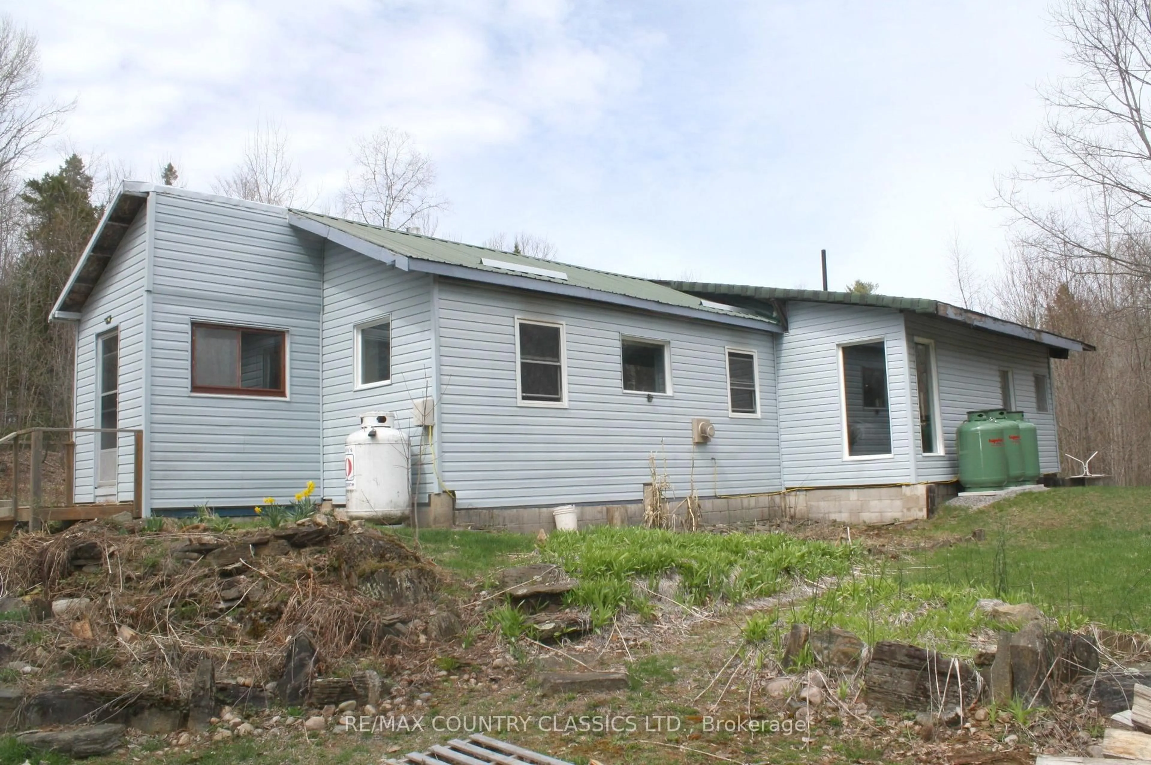 Home with vinyl exterior material, building for 2147 Old Hastings Rd, Coe Hill Ontario K0L 1P0