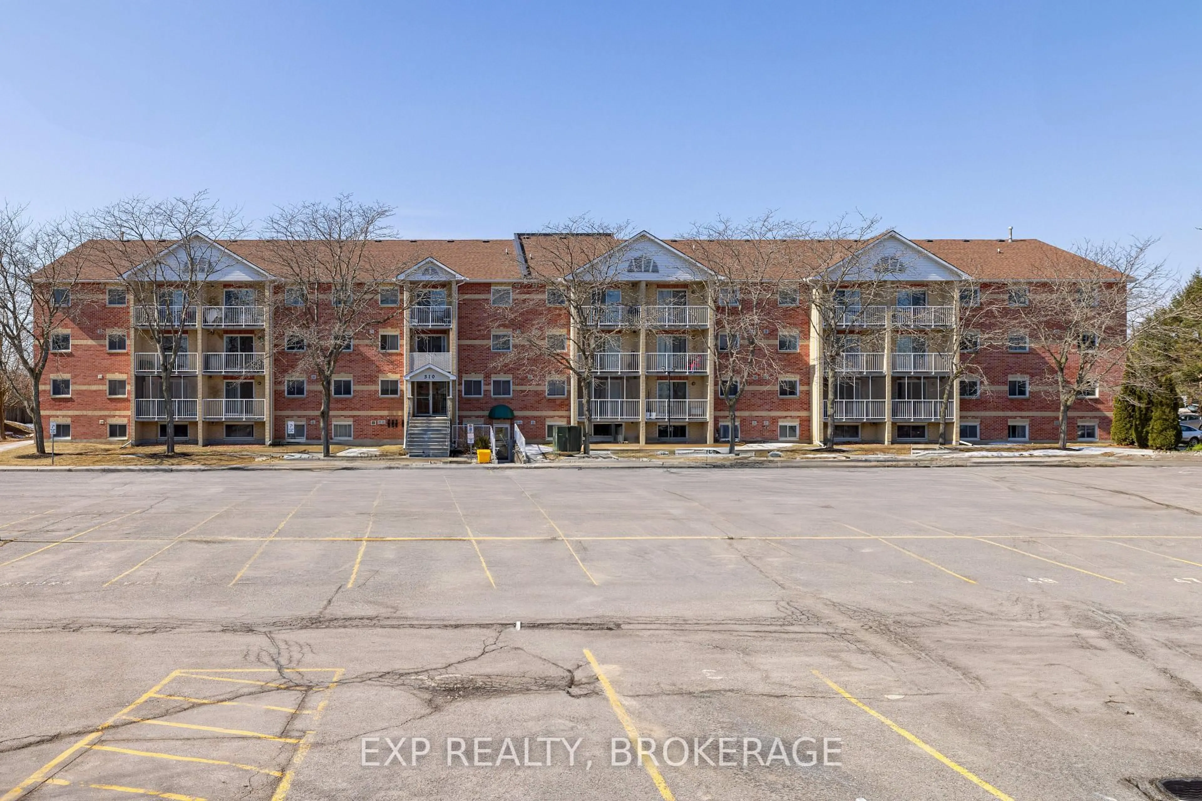 A pic from outside/outdoor area/front of a property/back of a property/a pic from drone, building for 310 Kingsdale Ave #302, Kingston Ontario K7M 8S1