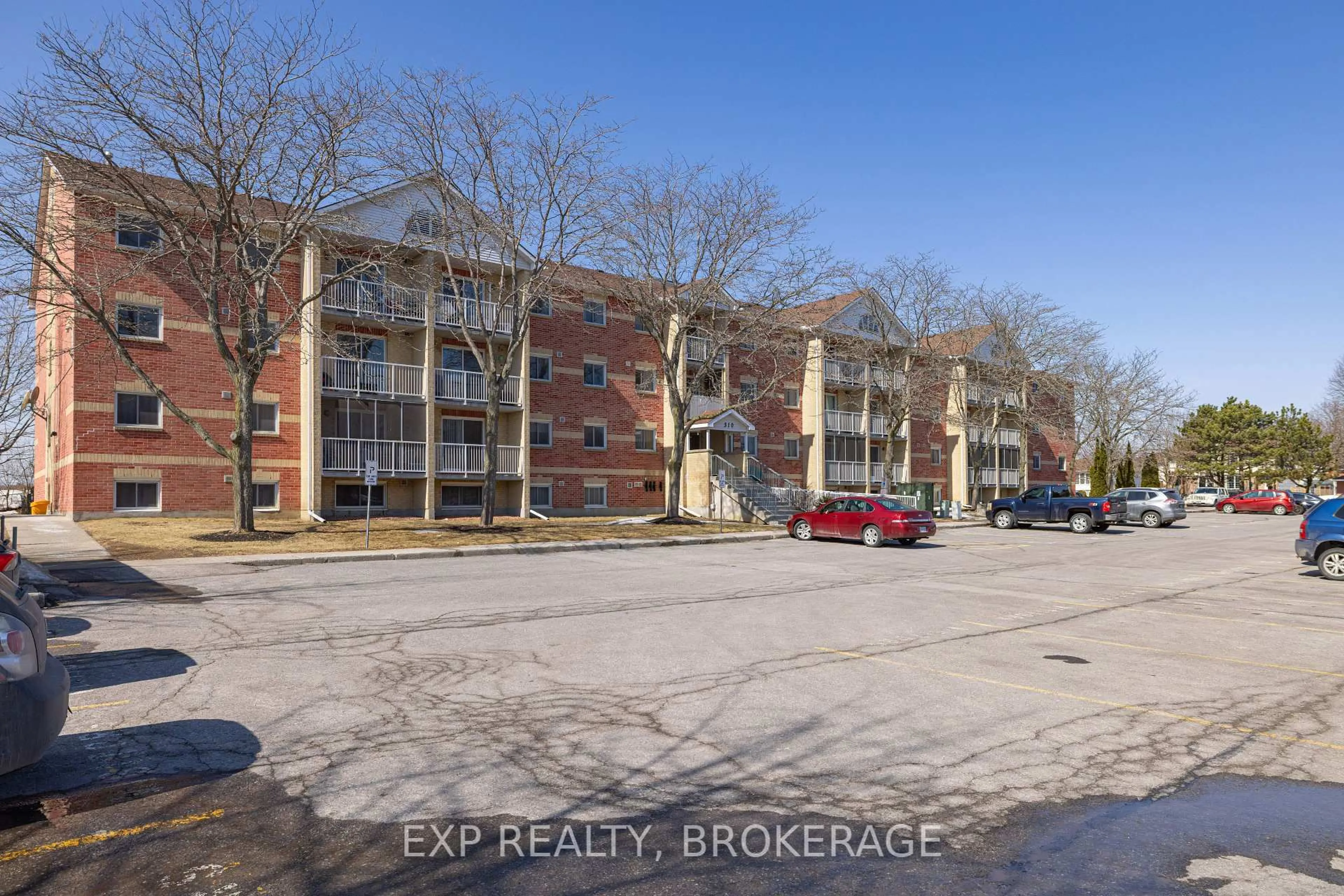 A pic from outside/outdoor area/front of a property/back of a property/a pic from drone, street for 310 Kingsdale Ave #302, Kingston Ontario K7M 8S1