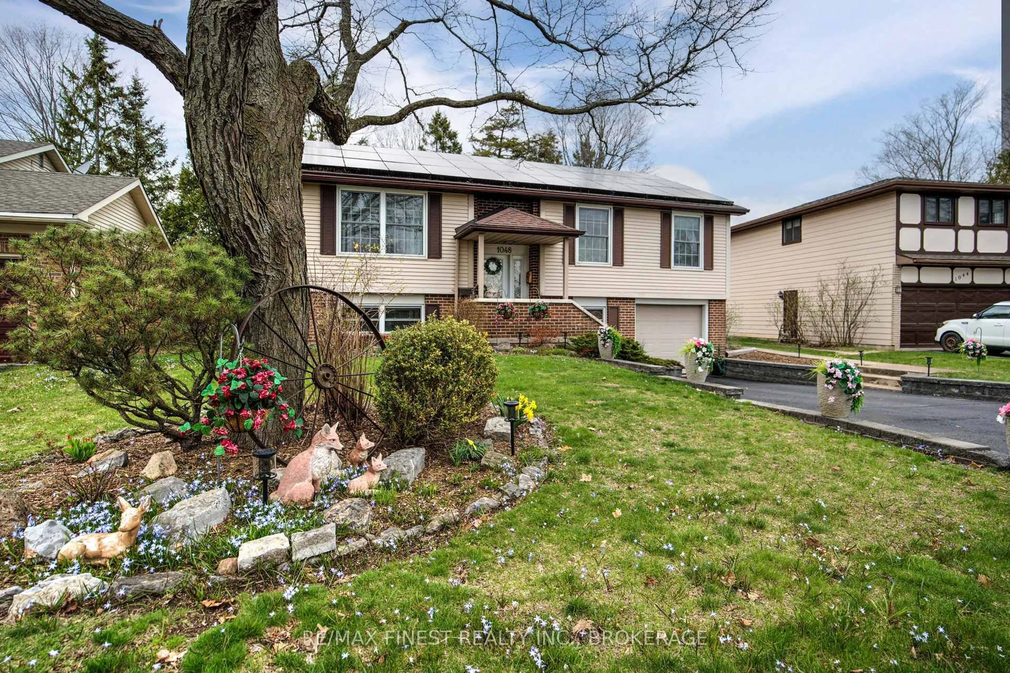 Home with vinyl exterior material, street for 1048 Bauder Cres, Kingston Ontario K7P 1M6