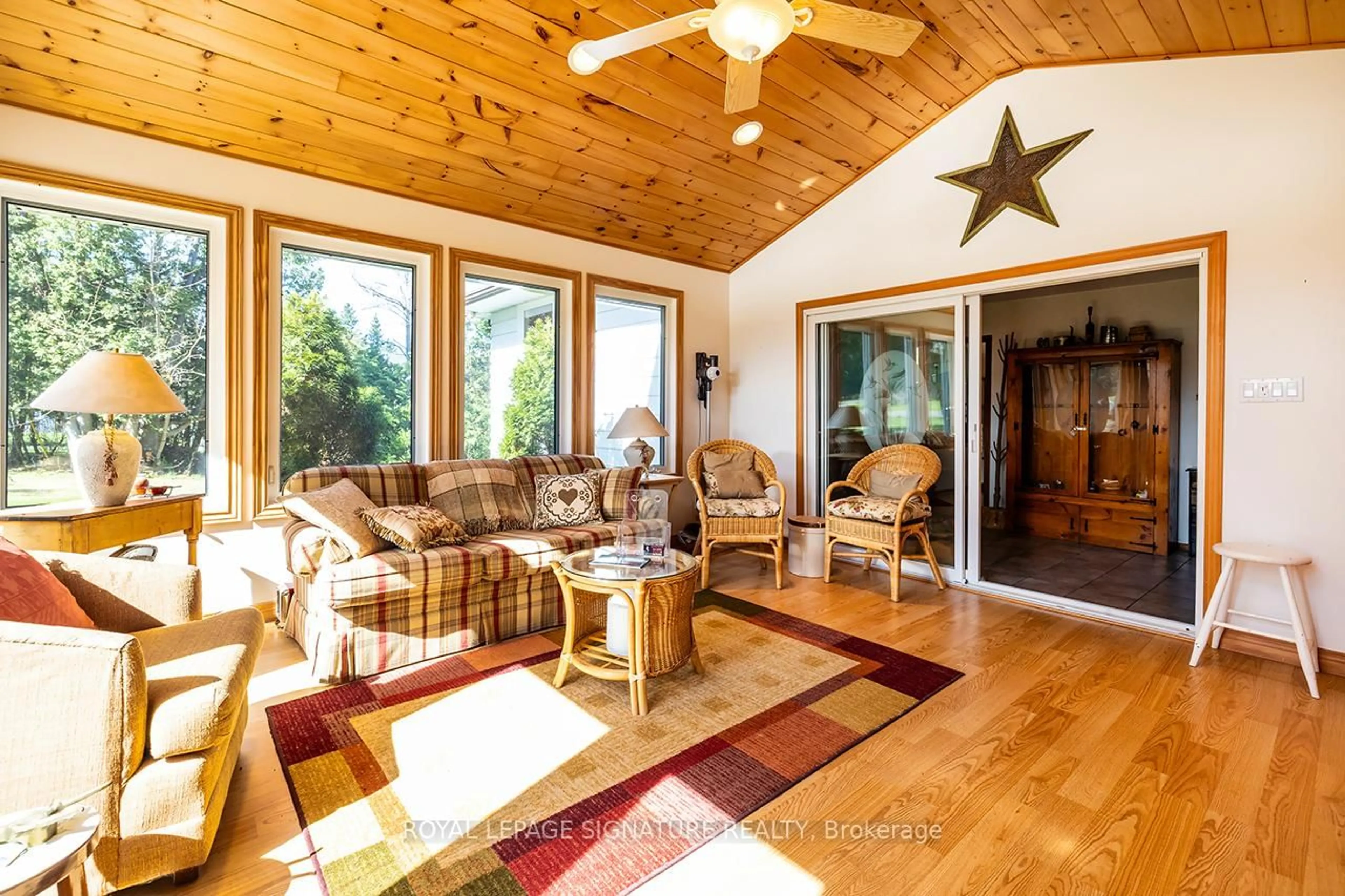 Living room with furniture, wood/laminate floor for 12 Romany Ranch Rd, Kawartha Lakes Ontario K0M 1G0