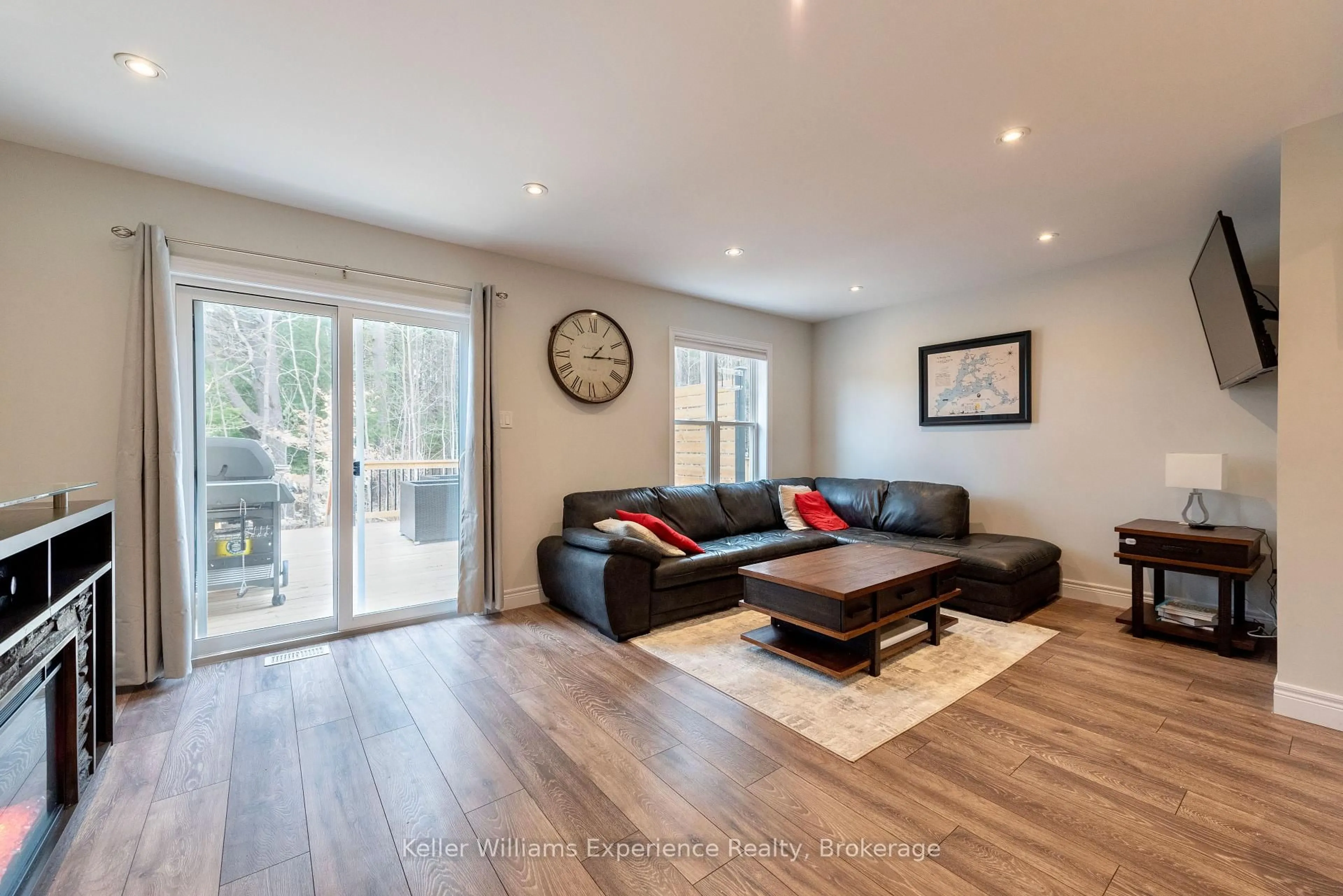 Living room with furniture, wood/laminate floor for 31 Nicole Park Crt, Bracebridge Ontario P1L 0C8