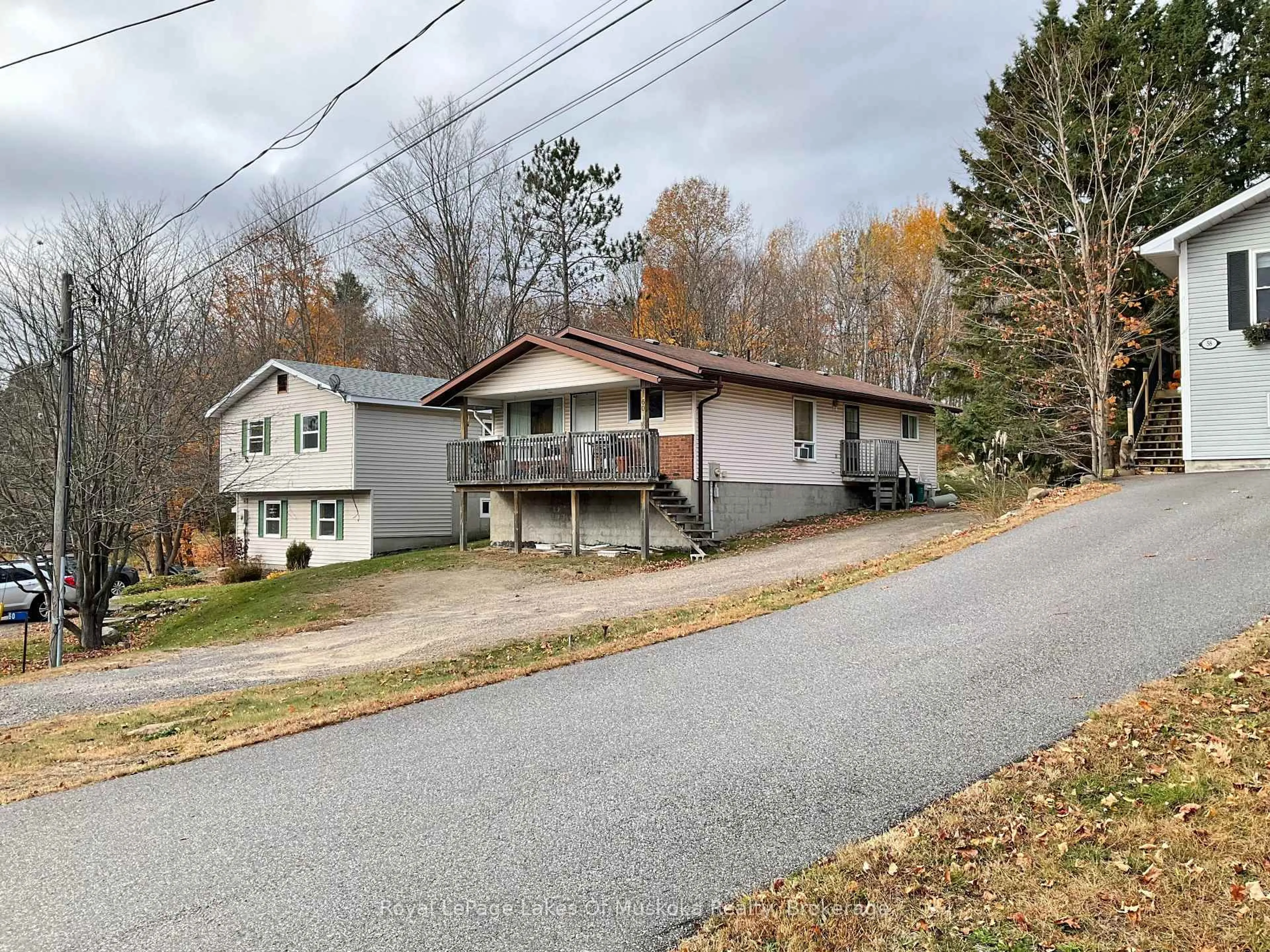A pic from outside/outdoor area/front of a property/back of a property/a pic from drone, street for 60 Hanes Rd, Huntsville Ontario P1H 1M3