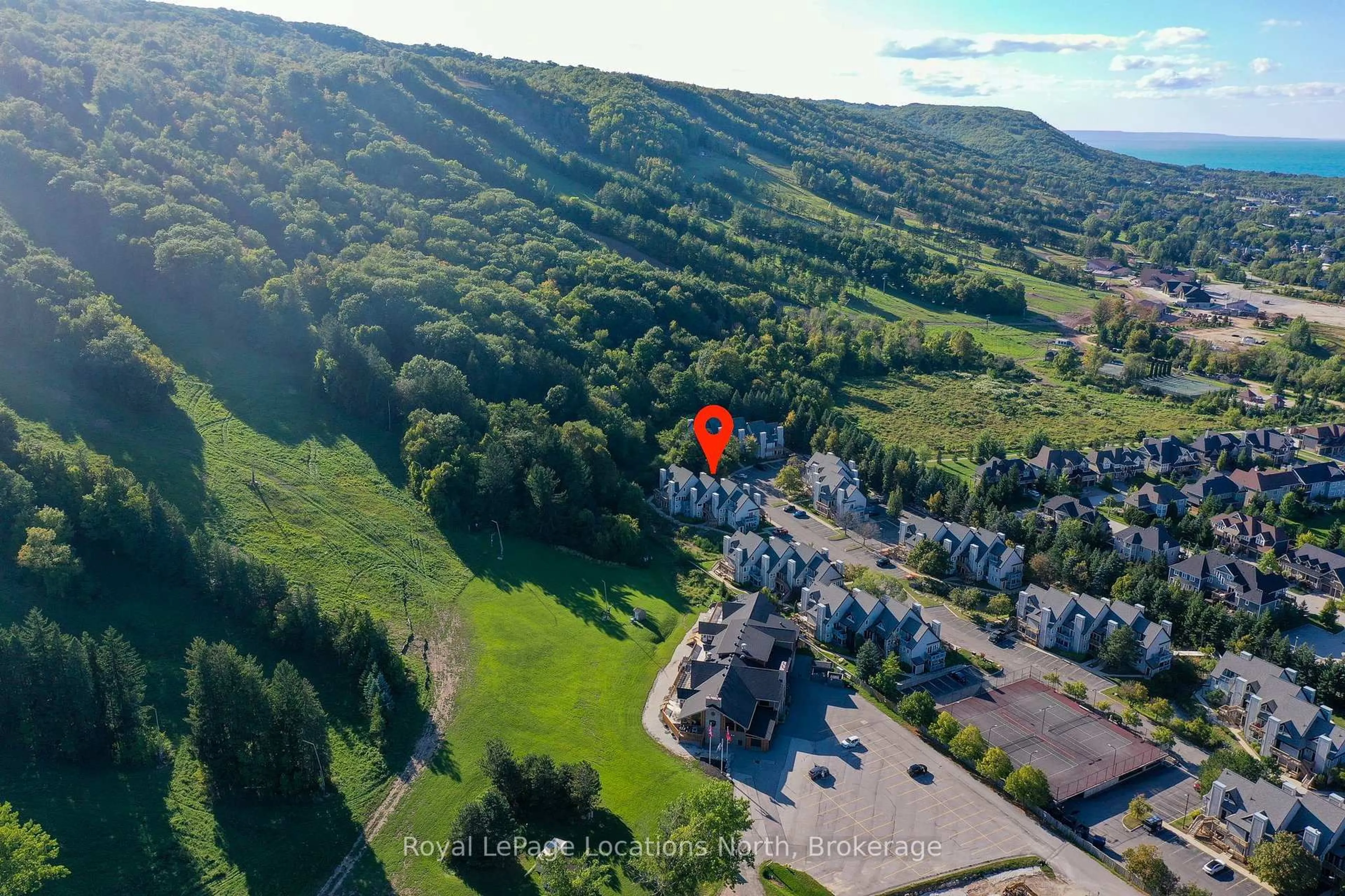A pic from outside/outdoor area/front of a property/back of a property/a pic from drone, mountain view for 796468 Grey 19 Rd #816, Blue Mountains Ontario L9Y 0N6
