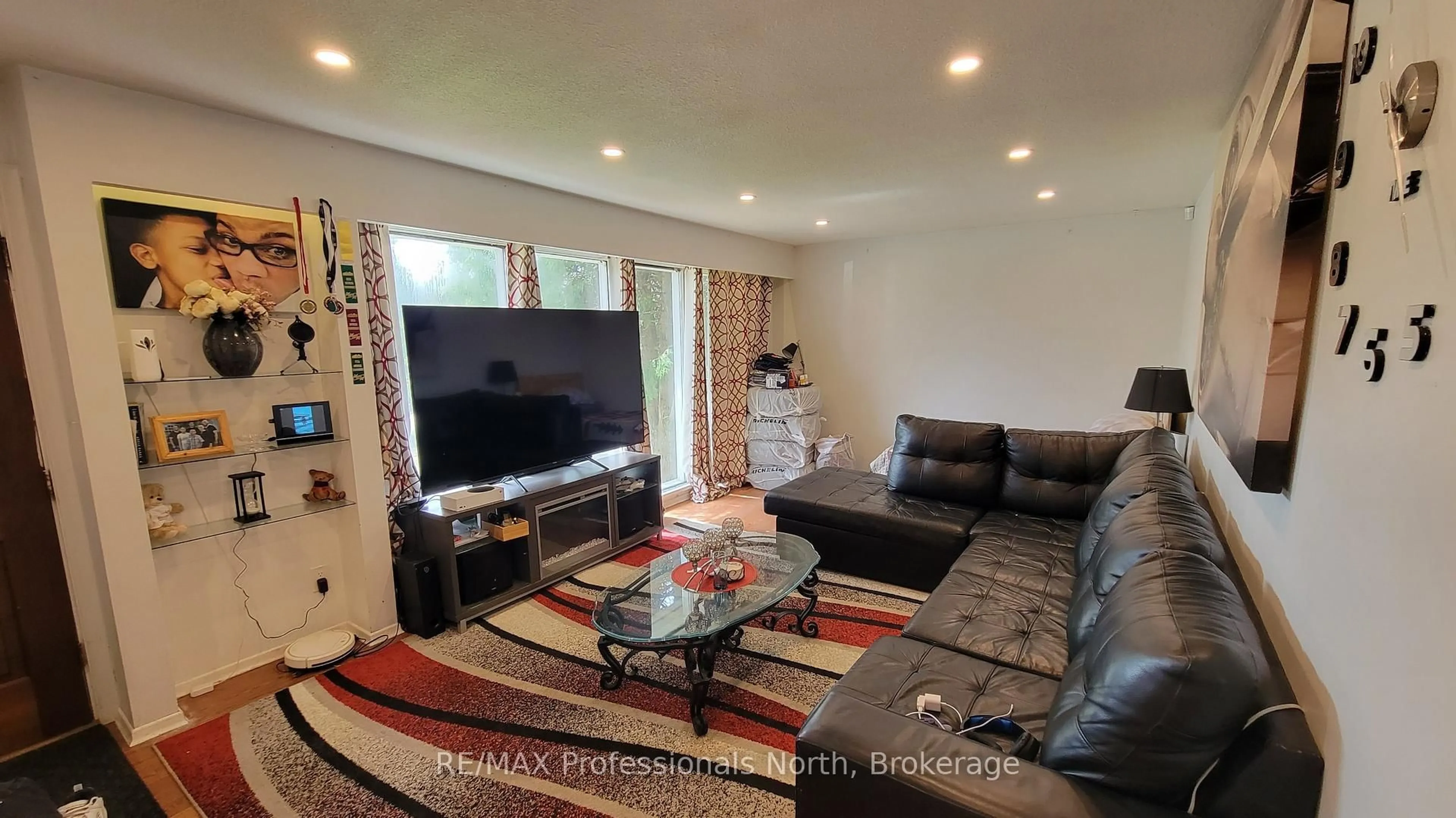 Living room with furniture, wood/laminate floor for 542 HIGHWAY 60 N/A, Huntsville Ontario P1H 1B5