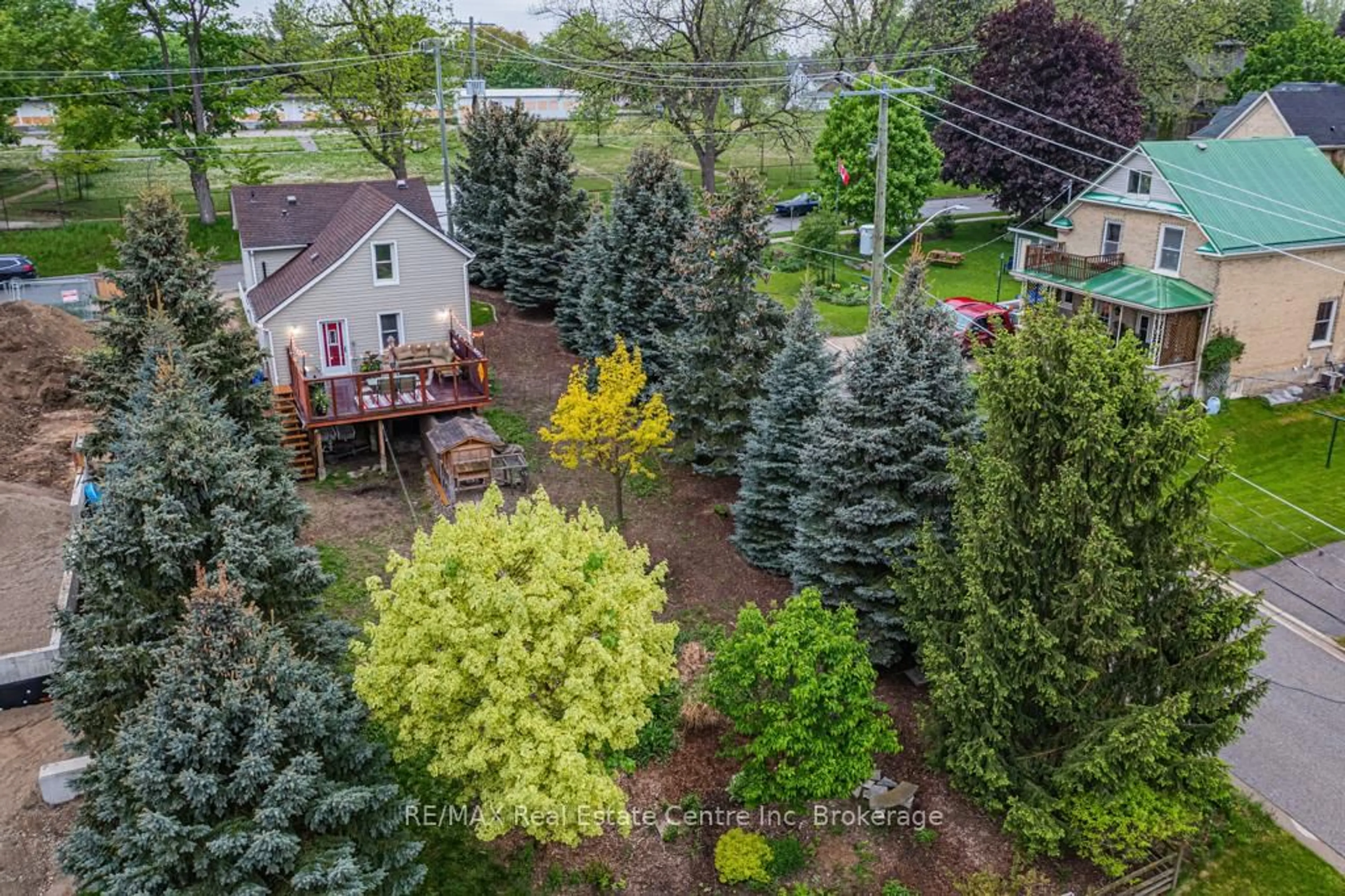 A pic from outside/outdoor area/front of a property/back of a property/a pic from drone, forest/trees view for 14 Riverside Dr, Woolwich Ontario N3B 1R1