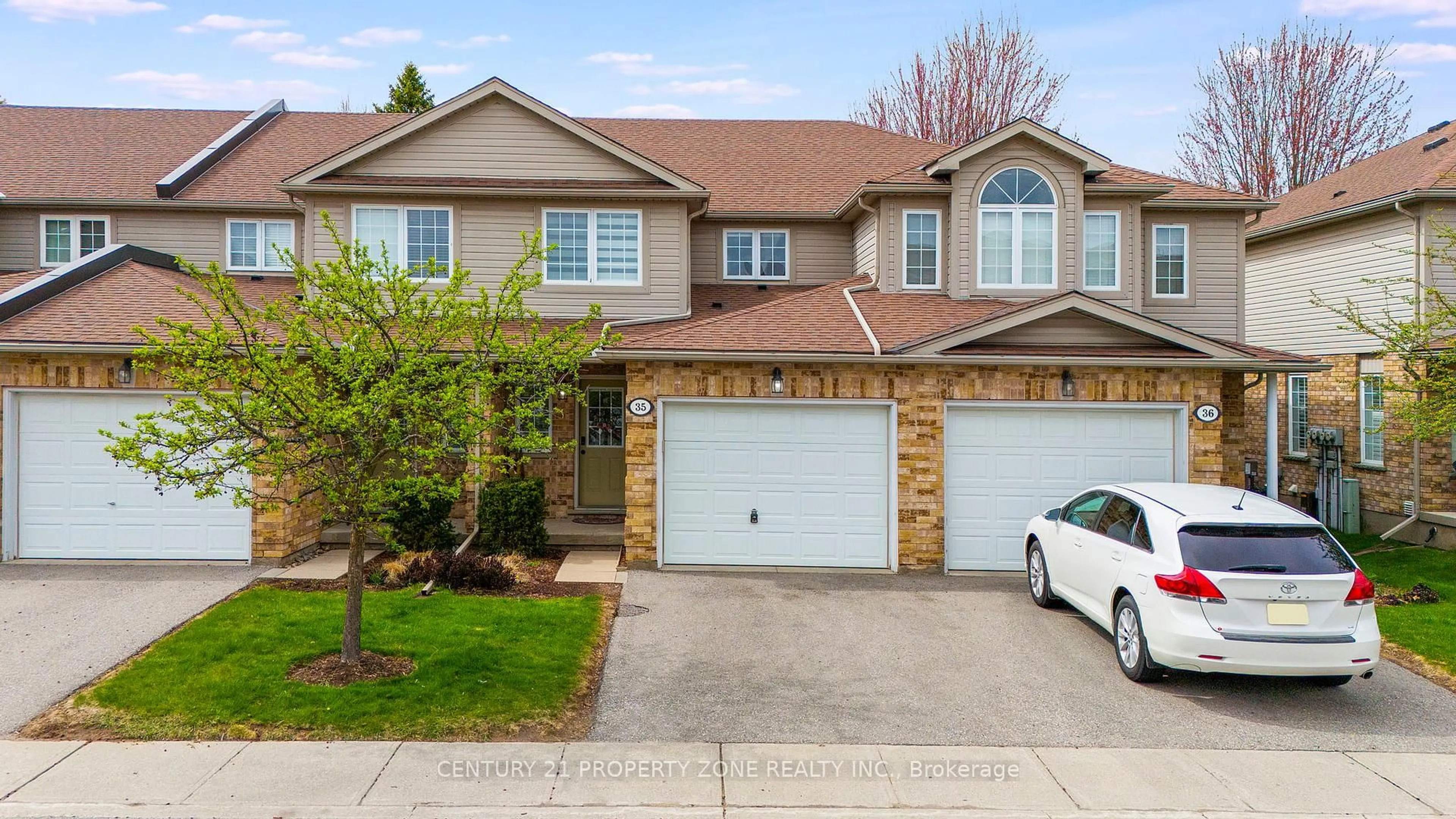 Home with brick exterior material, street for 210 DAWN Ave #35, Guelph Ontario N1G 5L5