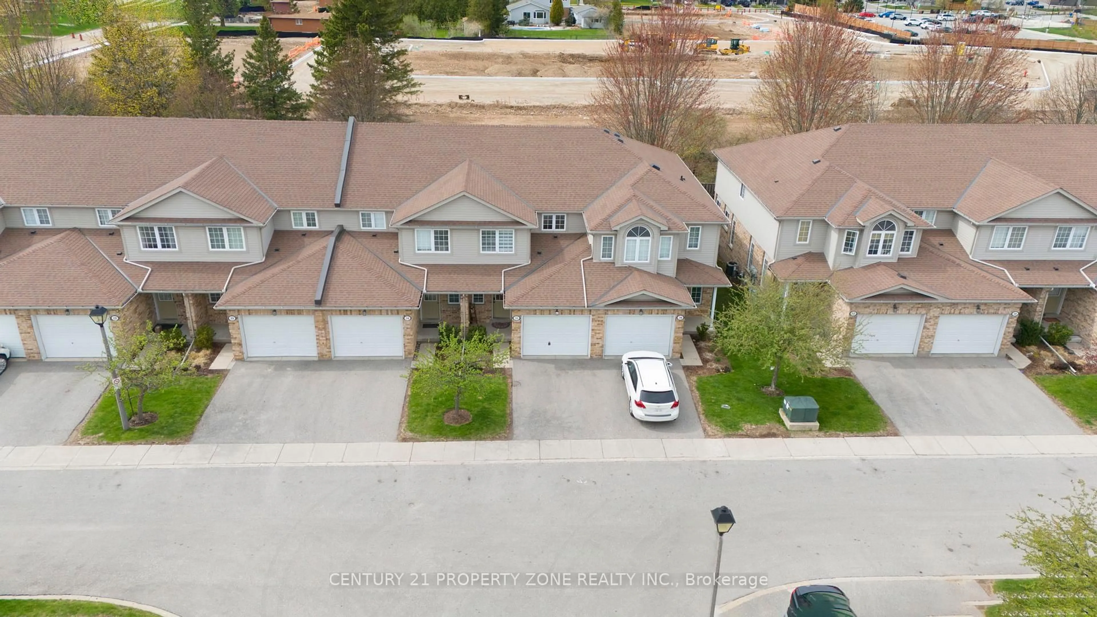 A pic from outside/outdoor area/front of a property/back of a property/a pic from drone, street for 210 DAWN Ave #35, Guelph Ontario N1G 5L5