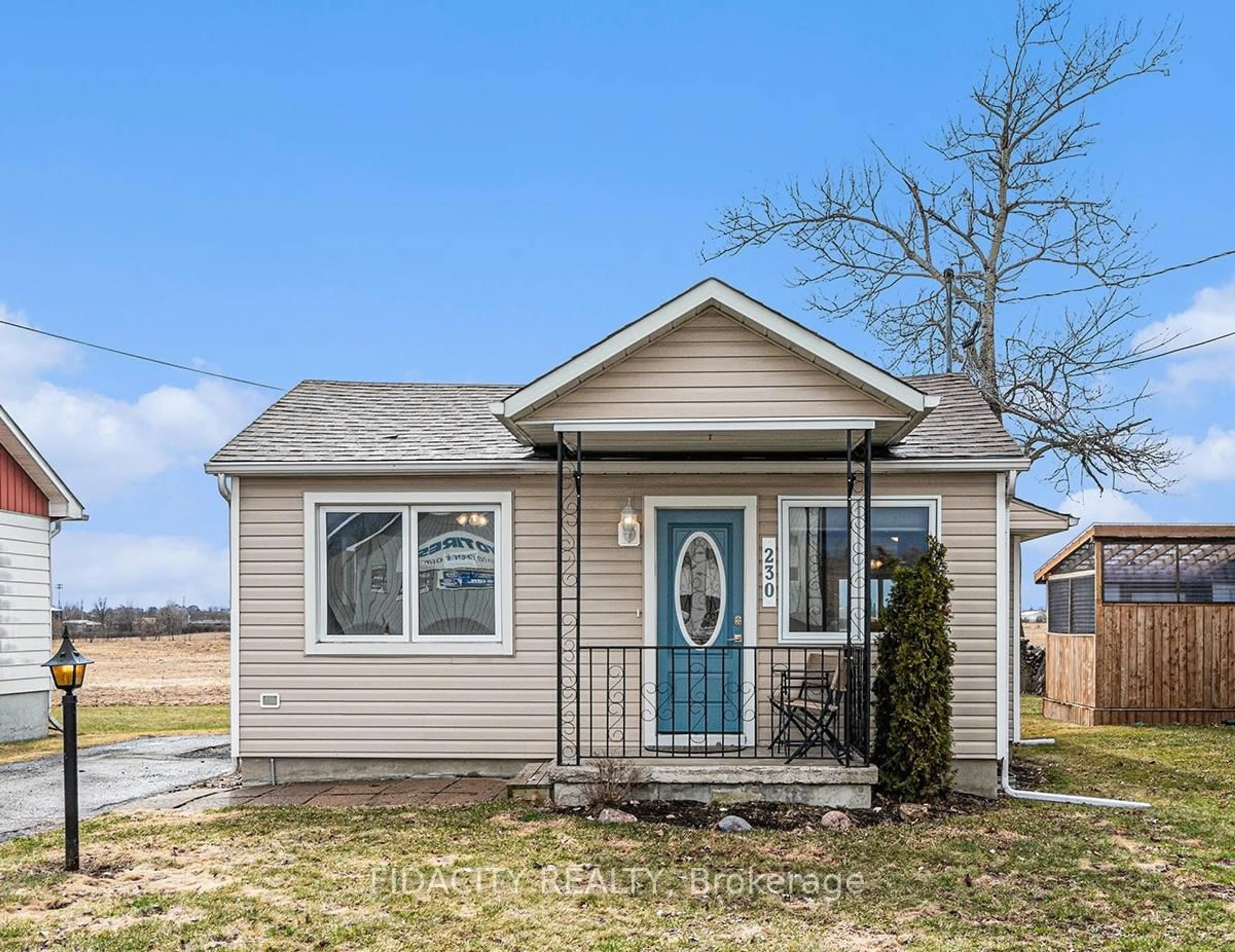 Home with vinyl exterior material, street for 230 Main St, North Dundas Ontario K0C 1H0