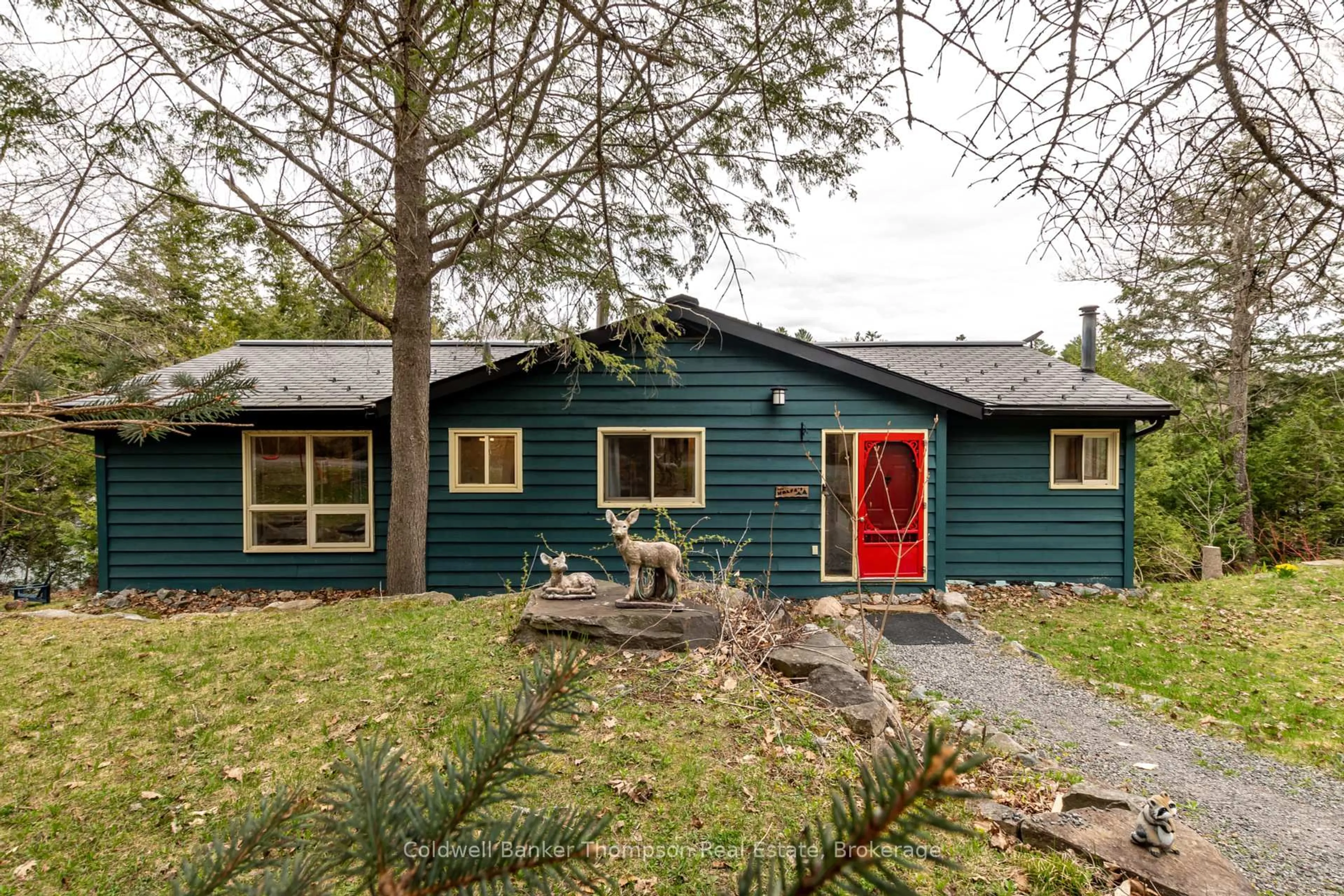 Home with vinyl exterior material, street for 1063 Lakeview Rd, Muskoka Lakes Ontario P0B 1M0