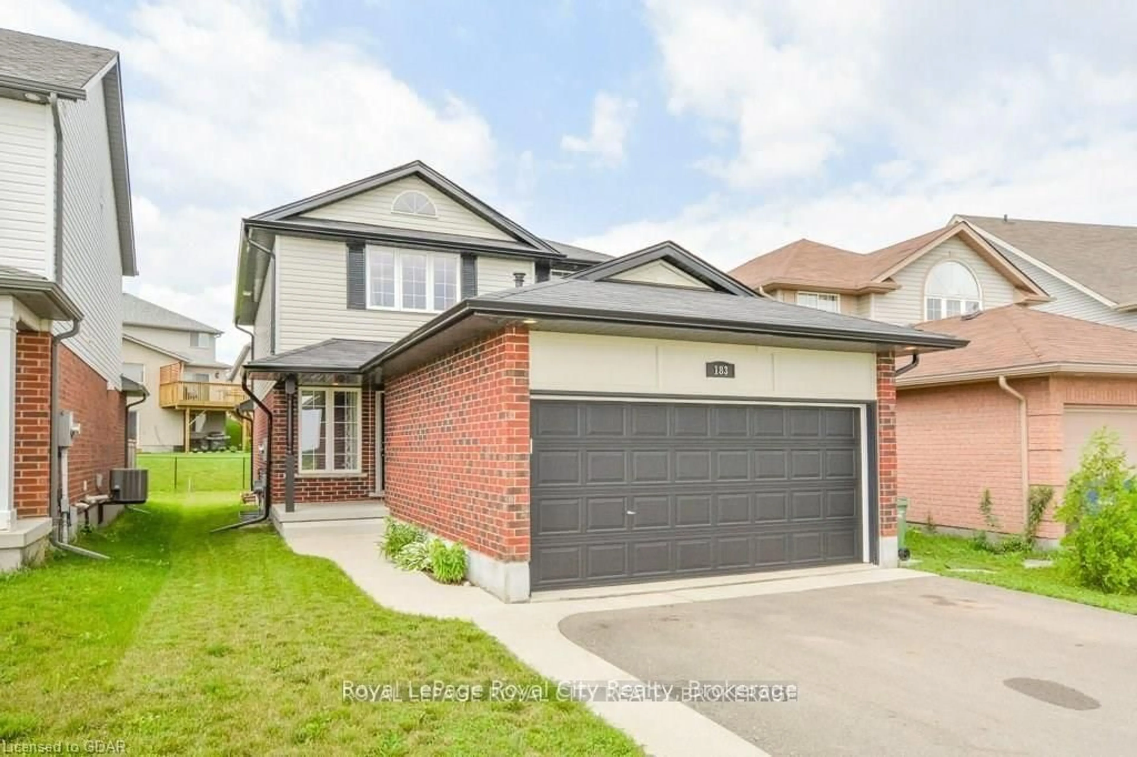 Home with brick exterior material, street for 183 Watson Rd, Guelph Ontario N1E 0C2