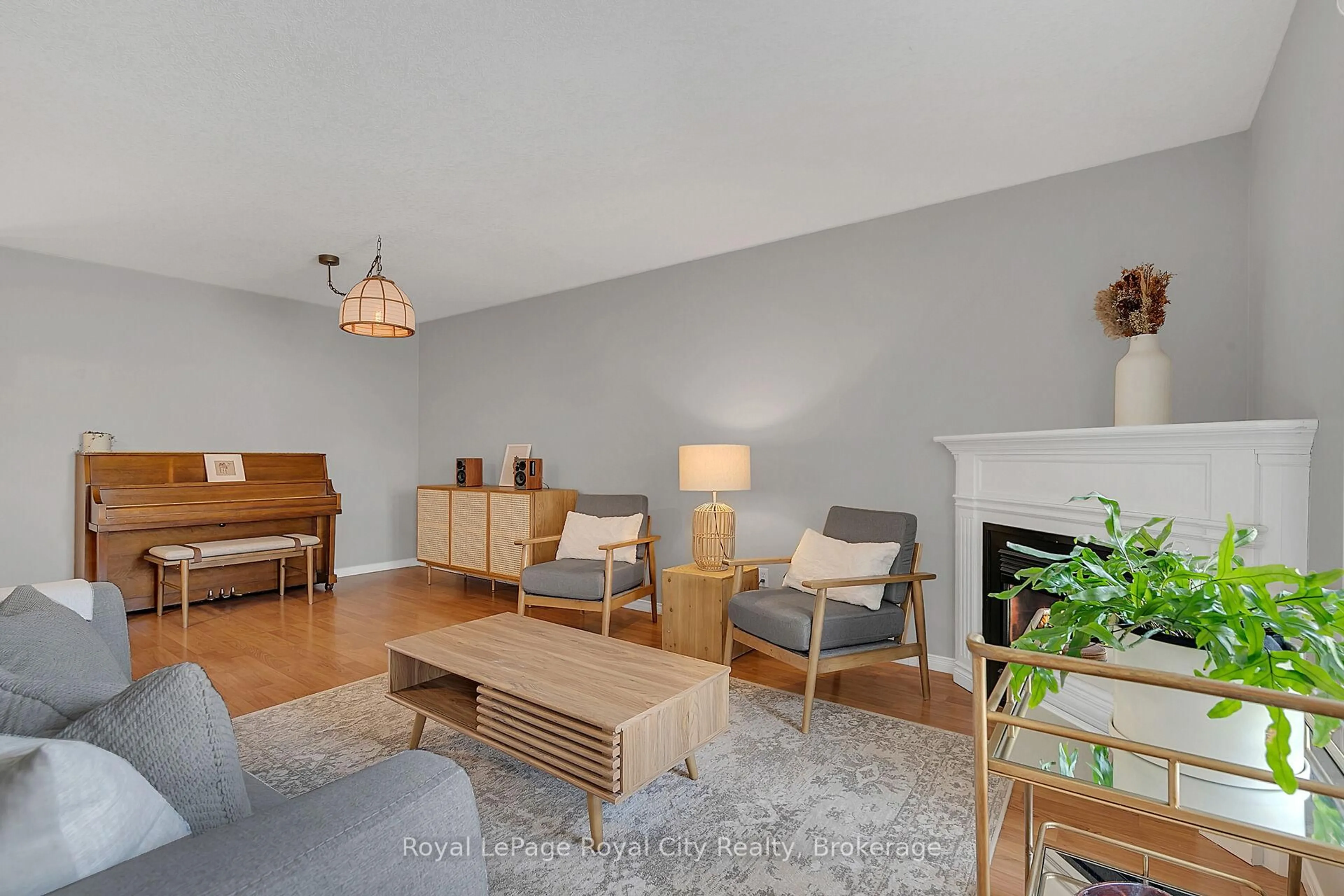 Living room with furniture, wood/laminate floor for 90 Milson Cres, Guelph Ontario N1C 1G6