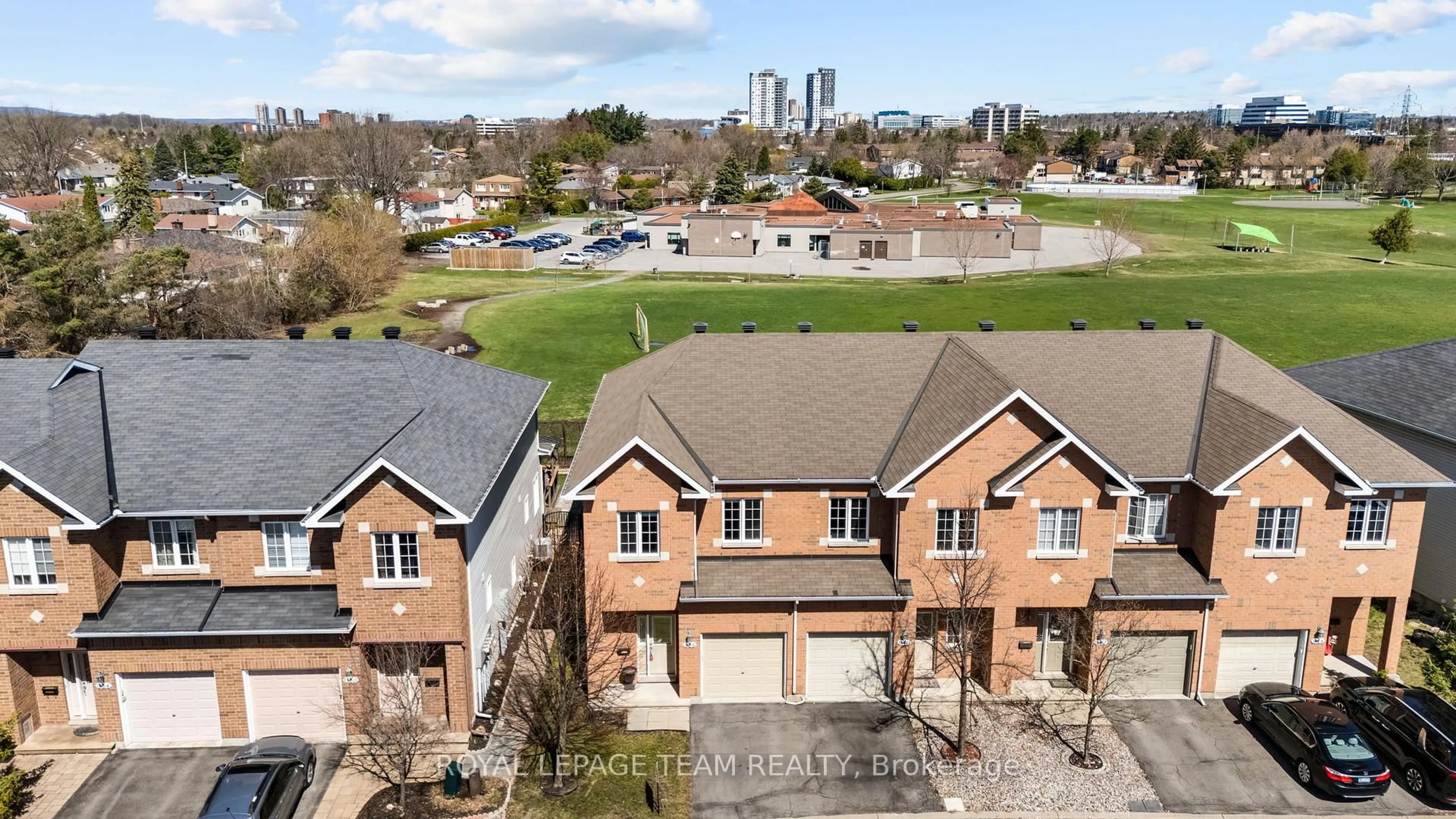 A pic from outside/outdoor area/front of a property/back of a property/a pic from drone, street for 938 Torovin Private Ave, Ottawa Ontario K1B 0A7