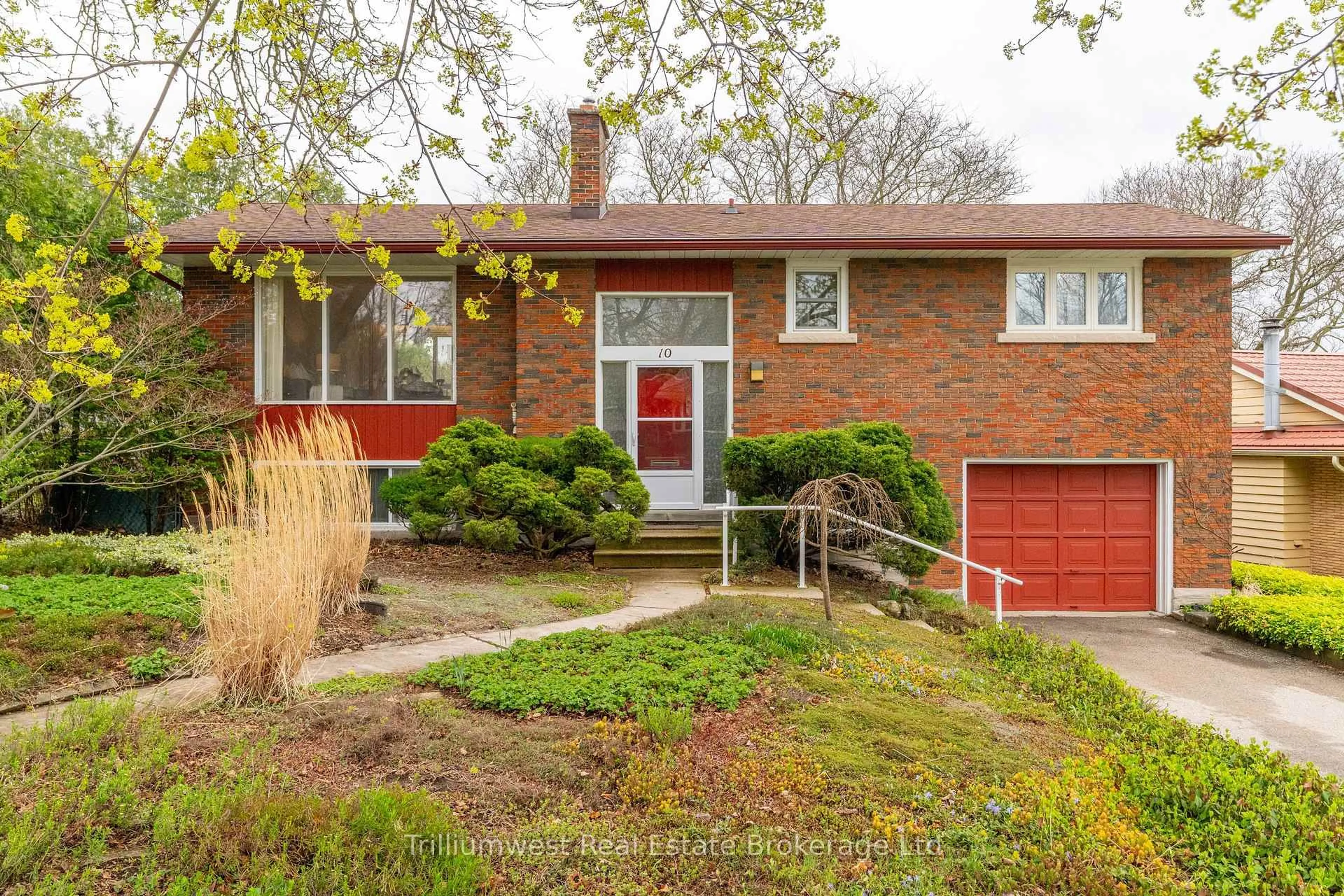 Home with brick exterior material, street for 10 Knightswood Blvd, Guelph Ontario N1E 3W4