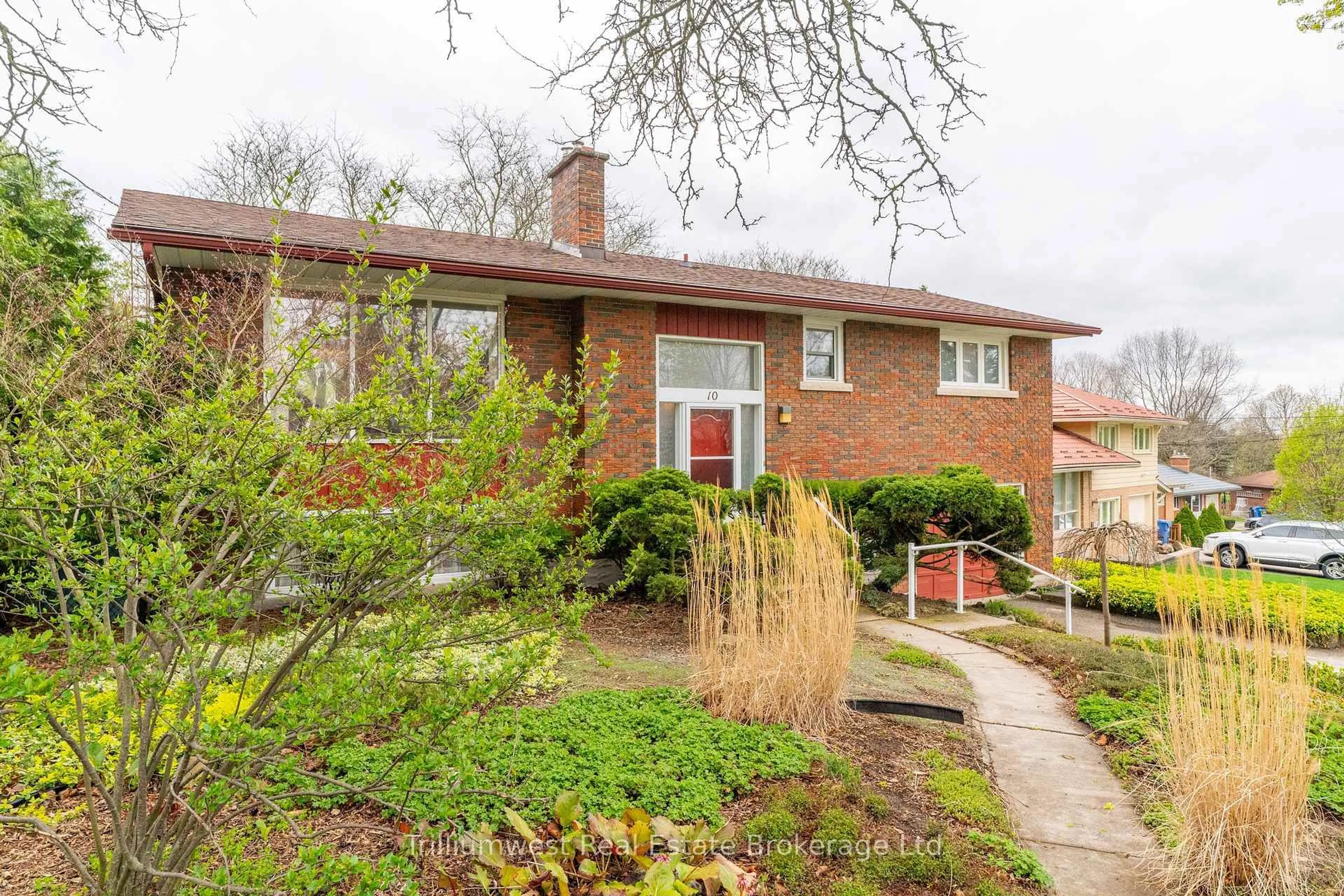 Home with brick exterior material, street for 10 Knightswood Blvd, Guelph Ontario N1E 3W4