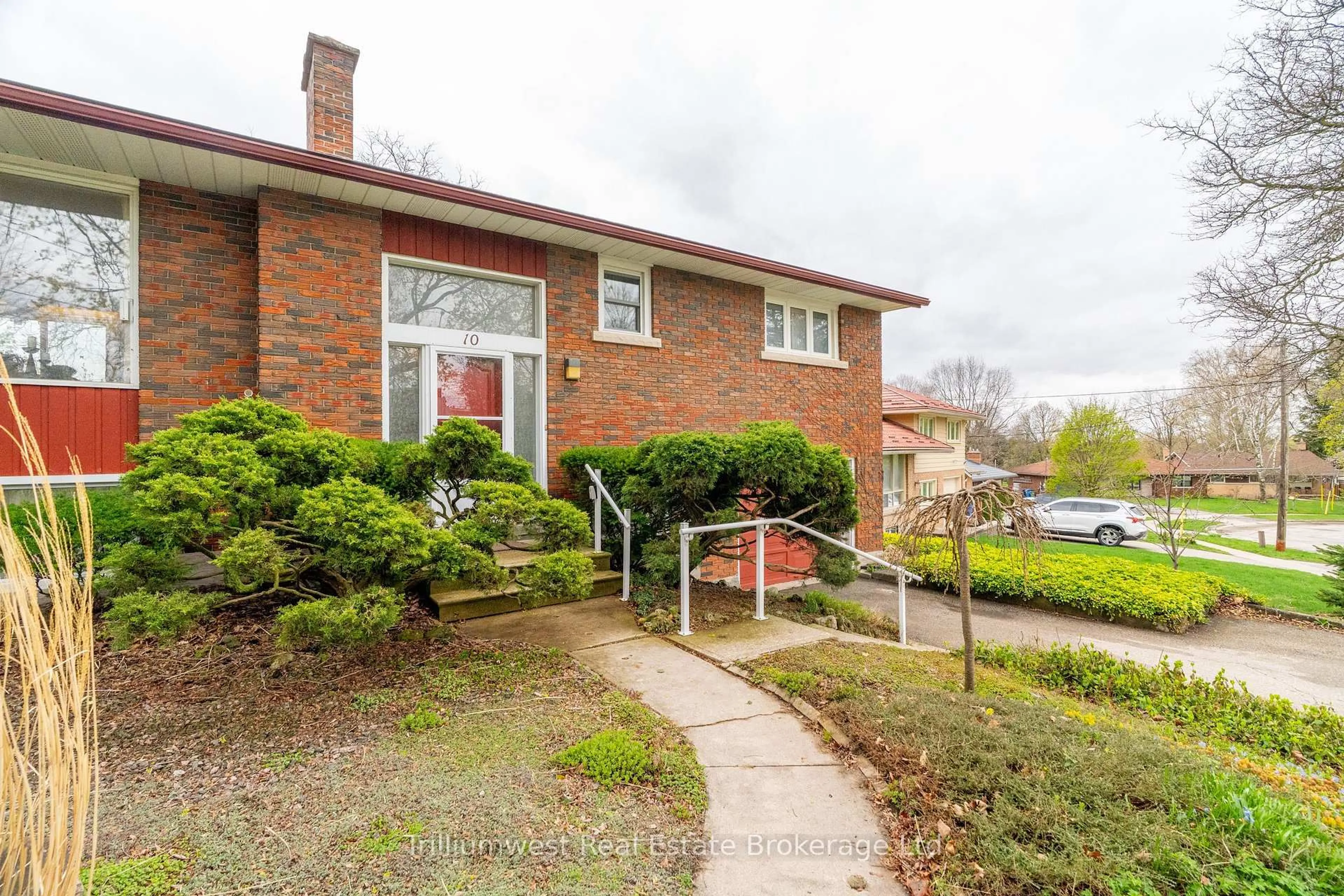 Home with brick exterior material, street for 10 Knightswood Blvd, Guelph Ontario N1E 3W4