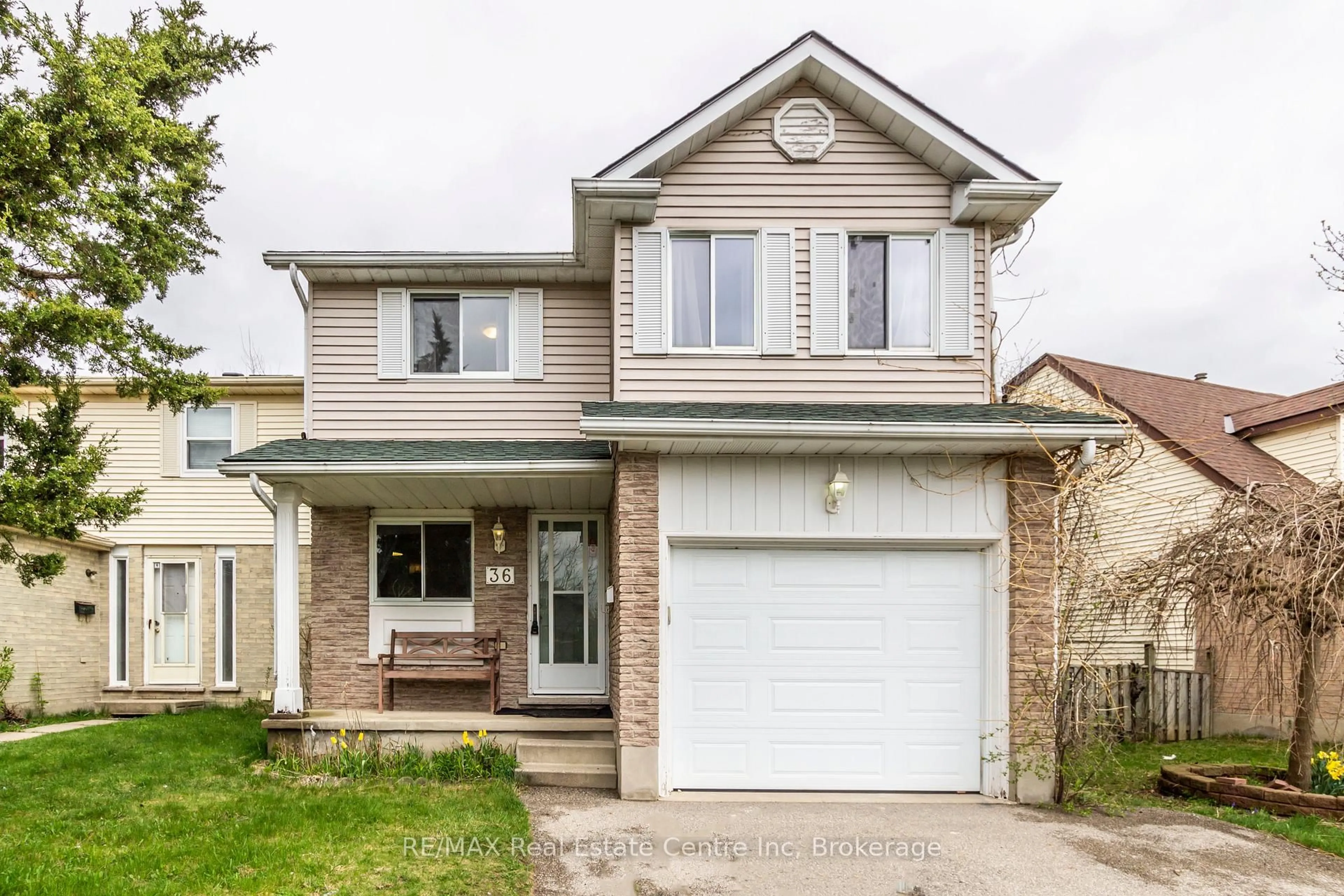 Home with vinyl exterior material, street for 36 Koch Dr, Guelph Ontario N1G 4G5