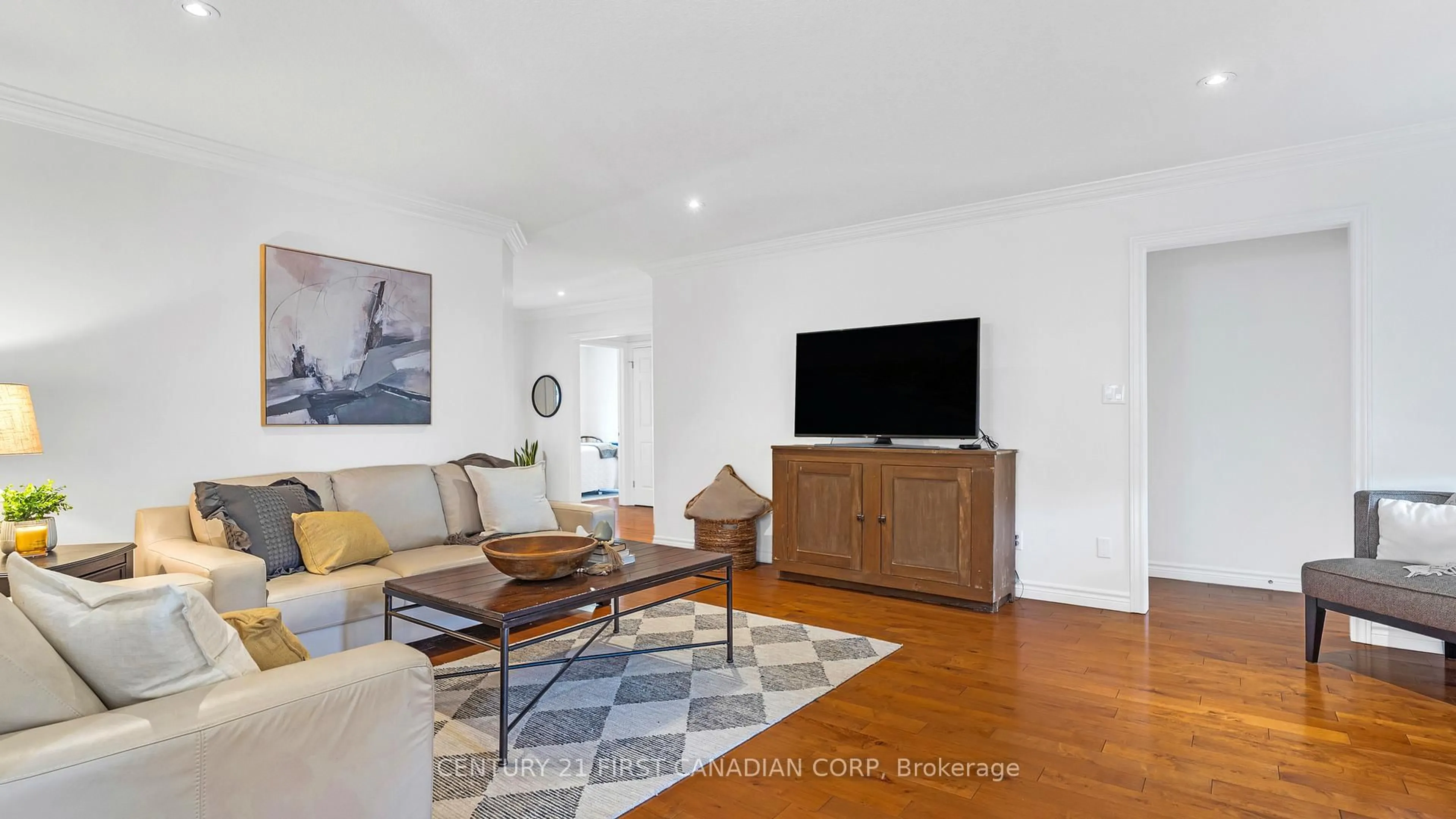 Living room with furniture, wood/laminate floor for 2606 Emerson St, Strathroy-Caradoc Ontario N0L 1W0