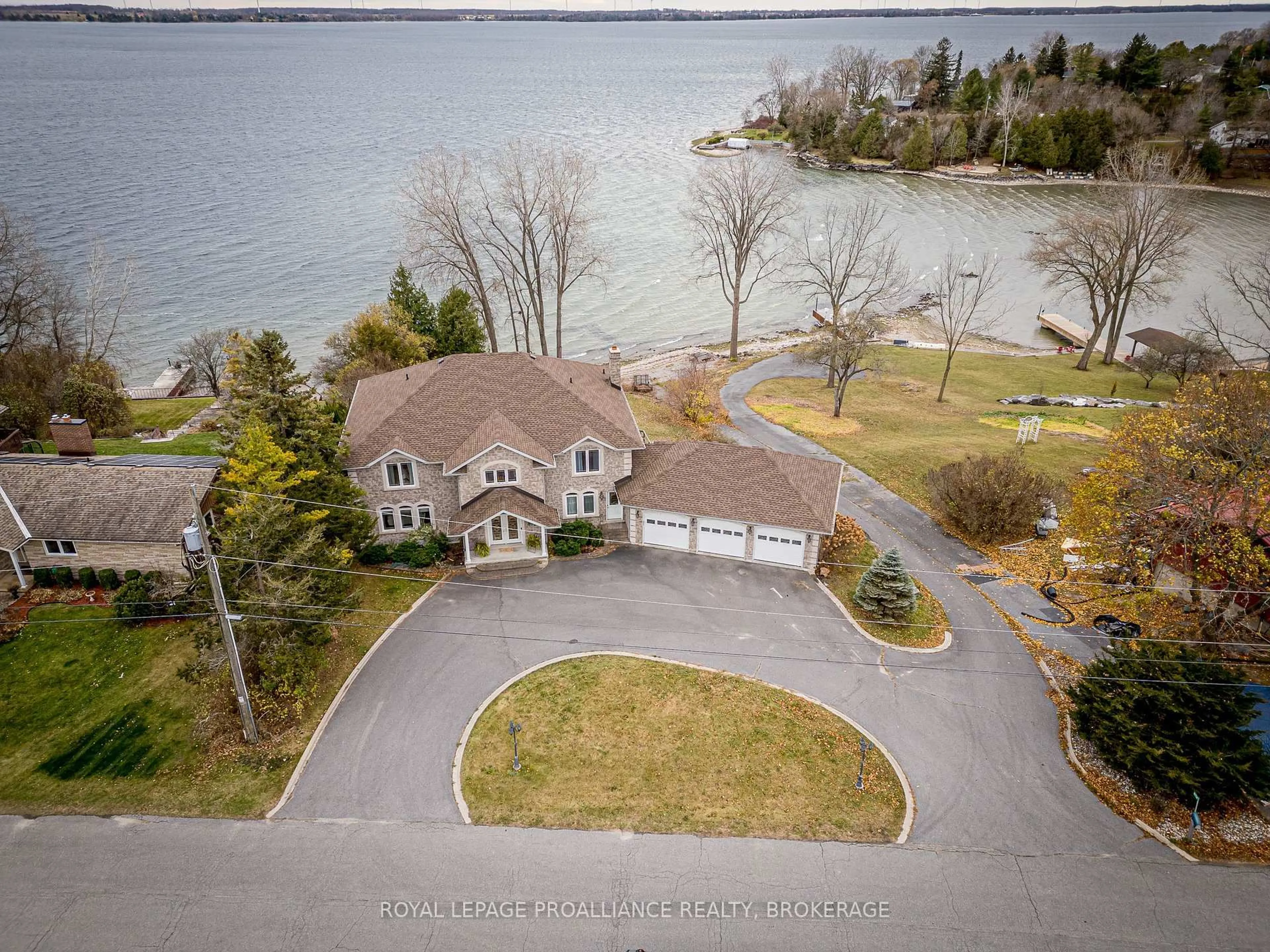 A pic from outside/outdoor area/front of a property/back of a property/a pic from drone, water/lake/river/ocean view for 4734 Lakeside Lane, Bath Ontario K0H 1G0
