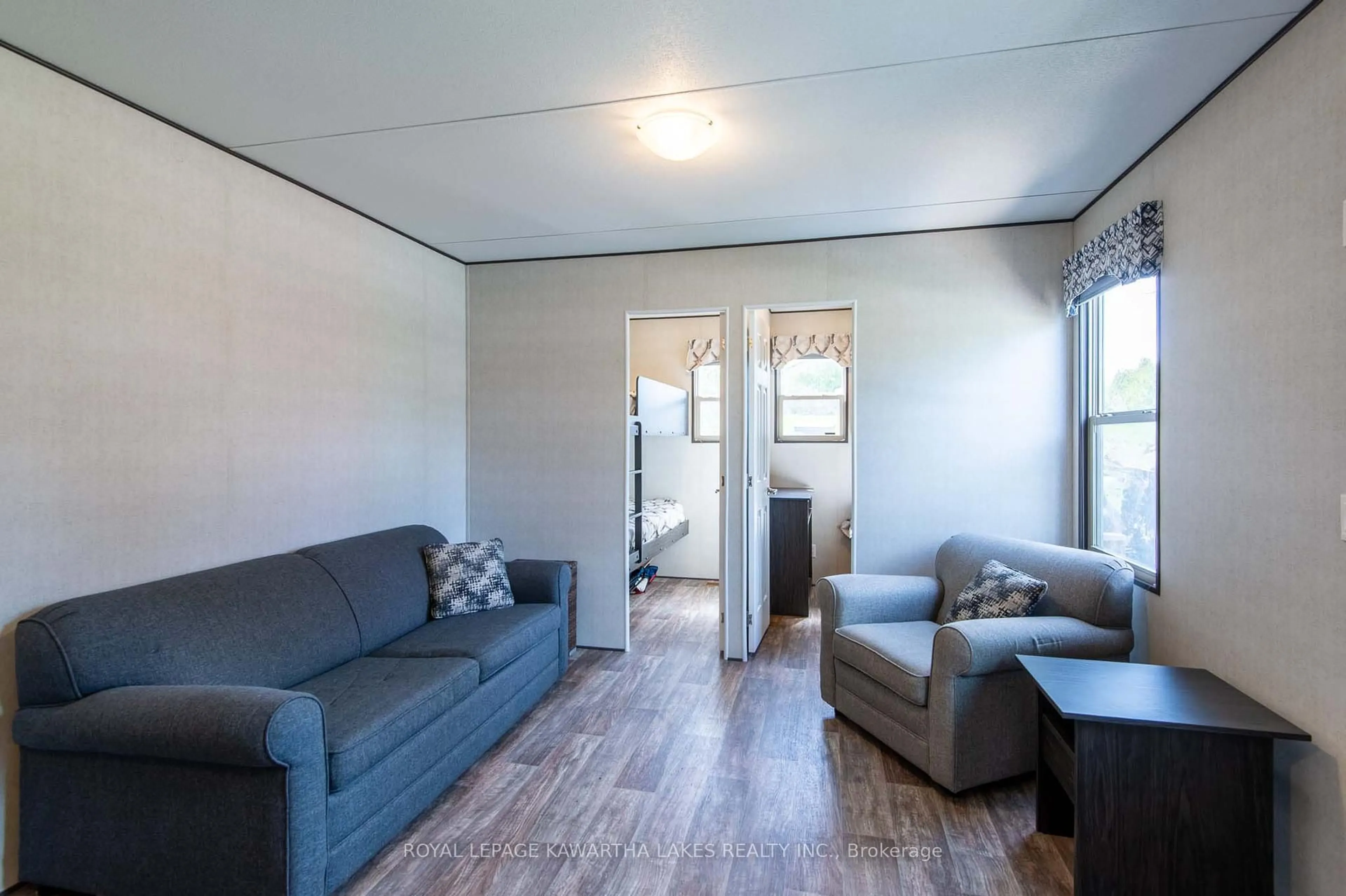 Living room with furniture, unknown for 657 Thunder Bridge Rd #27, Kawartha Lakes Ontario K9V 4R1