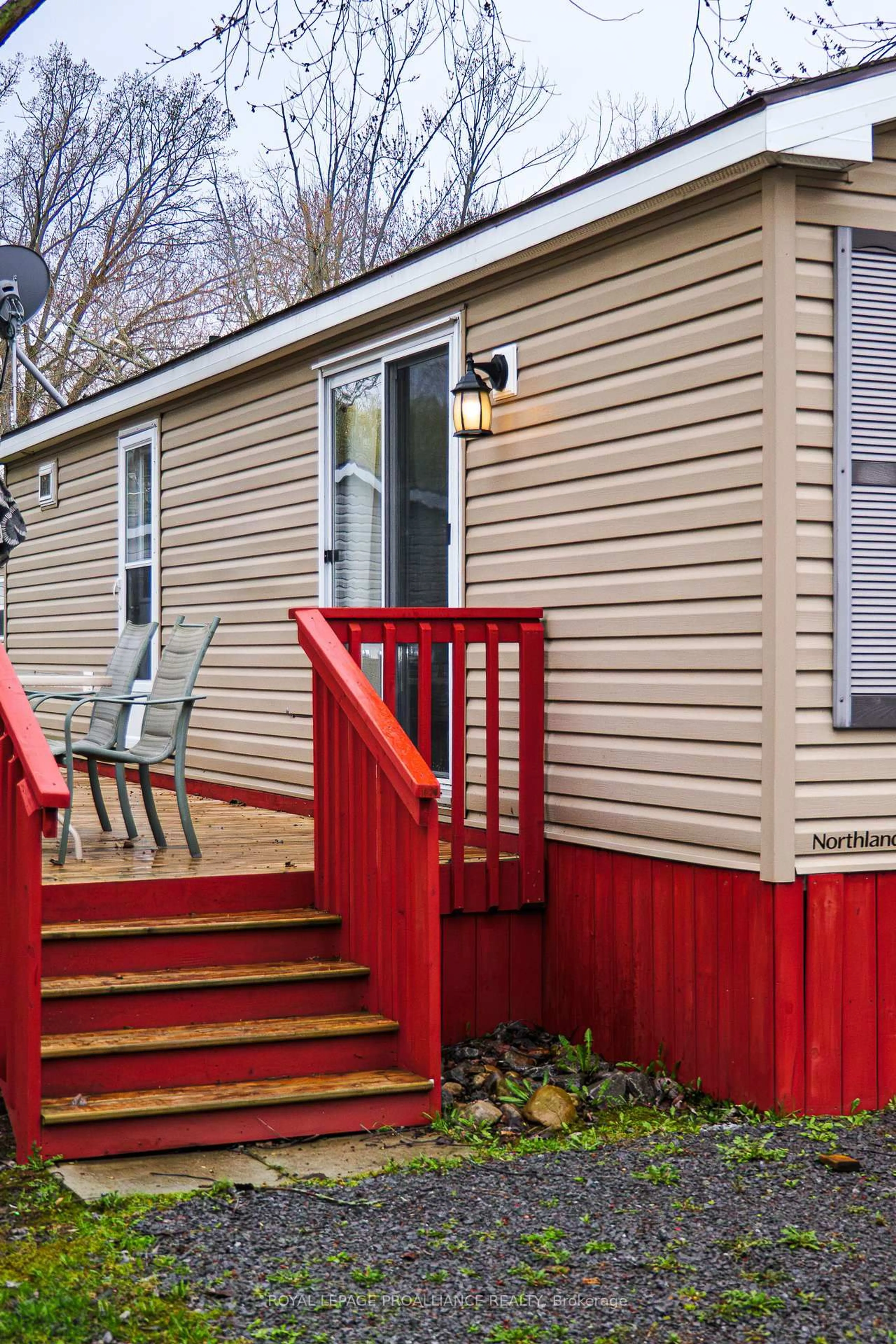 Home with vinyl exterior material, street for 486 County Rd 18 N/A #4 Park Meadow Lane, Prince Edward County Ontario K0K 1P0