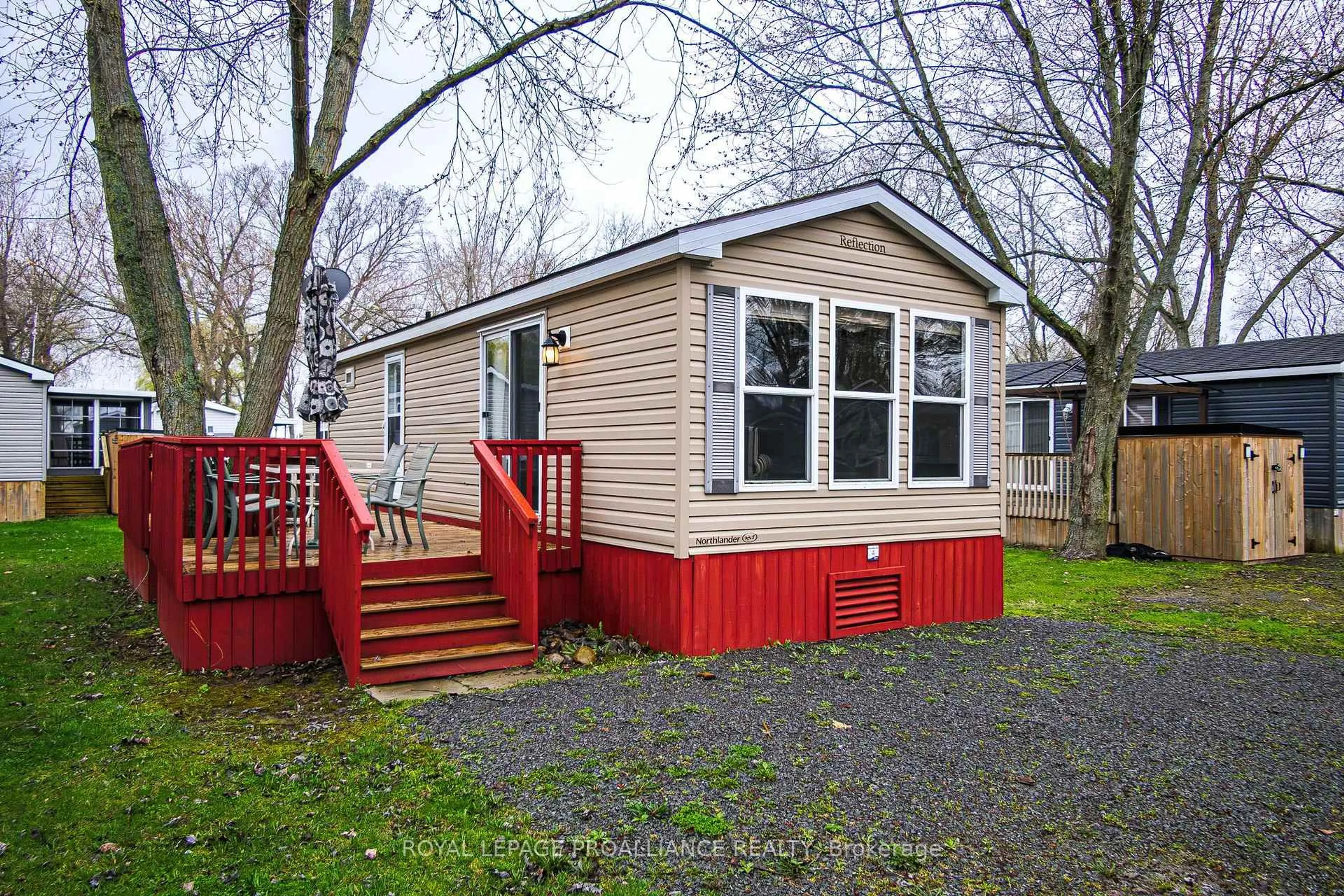 Home with vinyl exterior material, street for 486 County Rd 18 N/A #4 Park Meadow Lane, Prince Edward County Ontario K0K 1P0