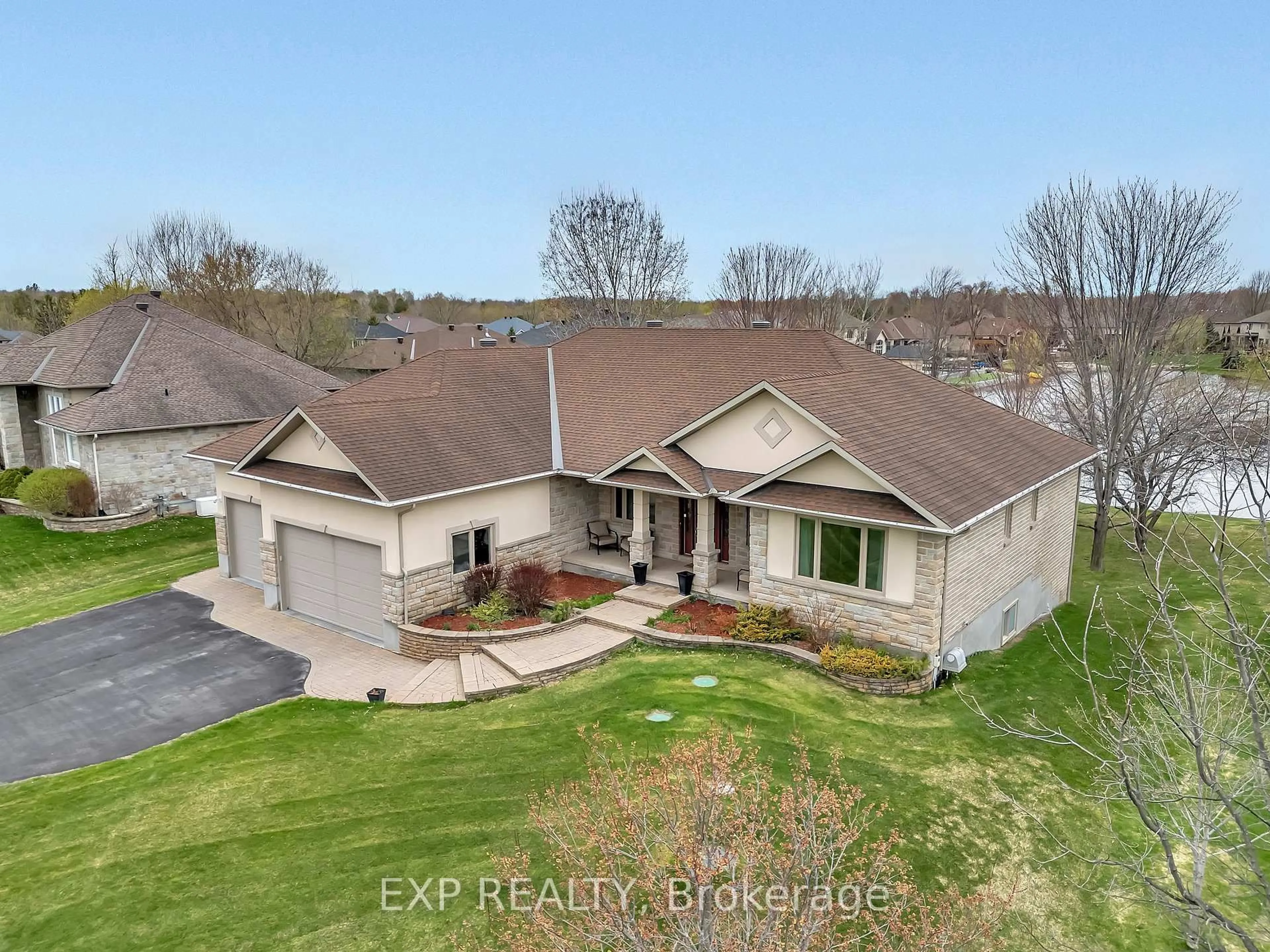 A pic from outside/outdoor area/front of a property/back of a property/a pic from drone, water/lake/river/ocean view for 6703 Suncrest Dr, Greely Ontario K4P 0B4