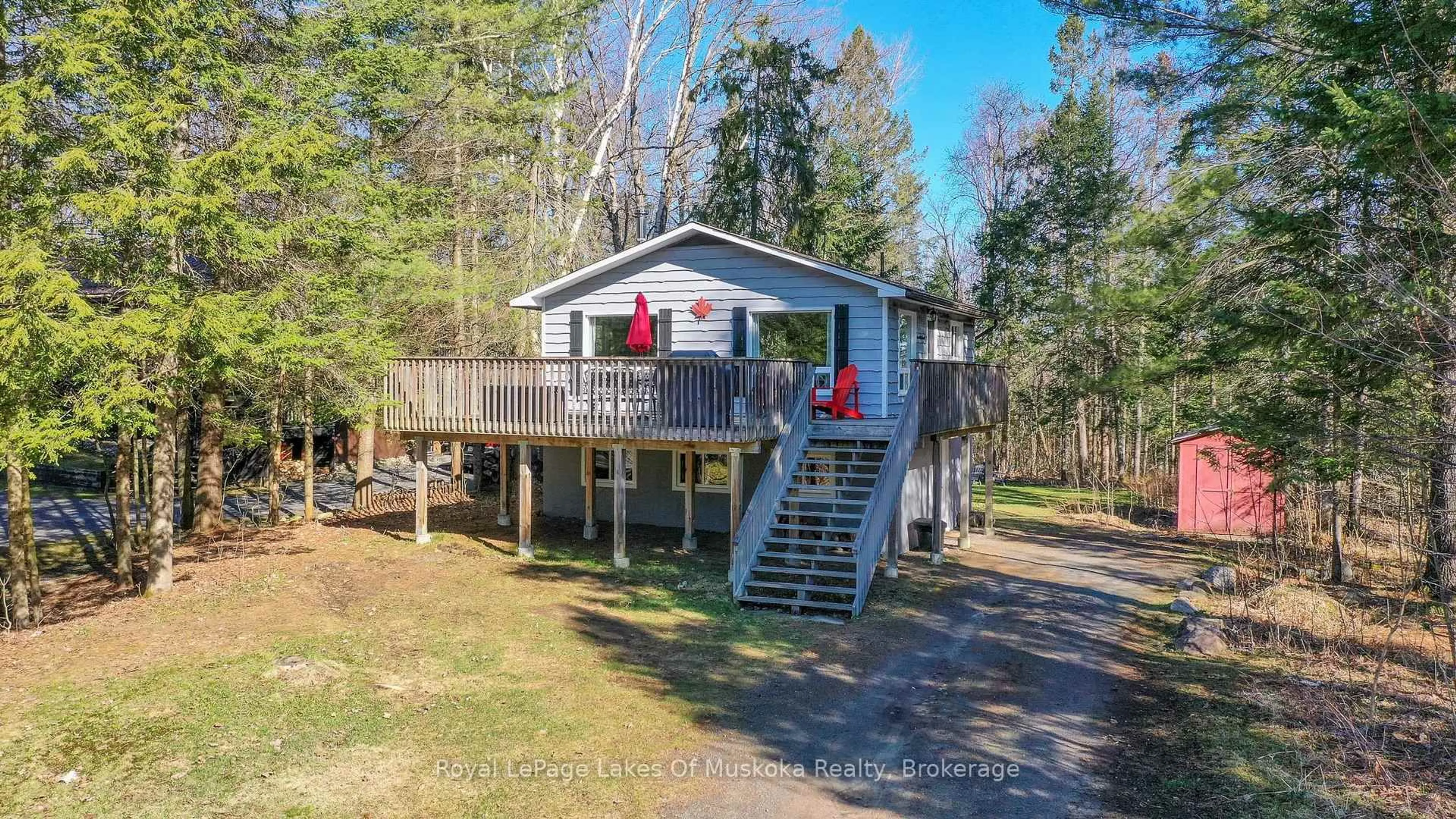A pic from outside/outdoor area/front of a property/back of a property/a pic from drone, water/lake/river/ocean view for 1582 Skyline Dr, Huntsville Ontario P1H 1A5