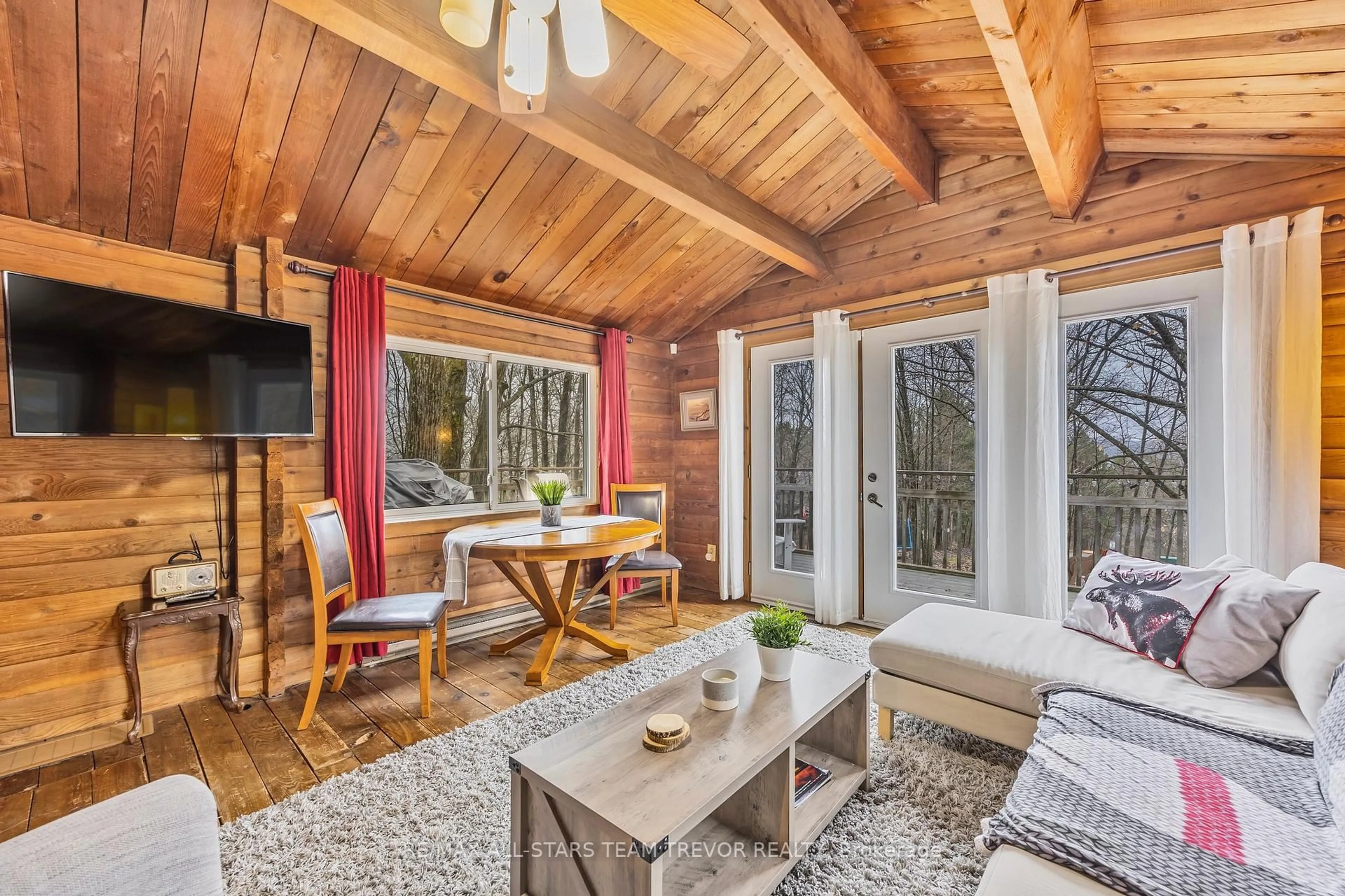 Living room with furniture, wood/laminate floor for 143 Chalet Cres, Huntsville Ontario P1H 1A8