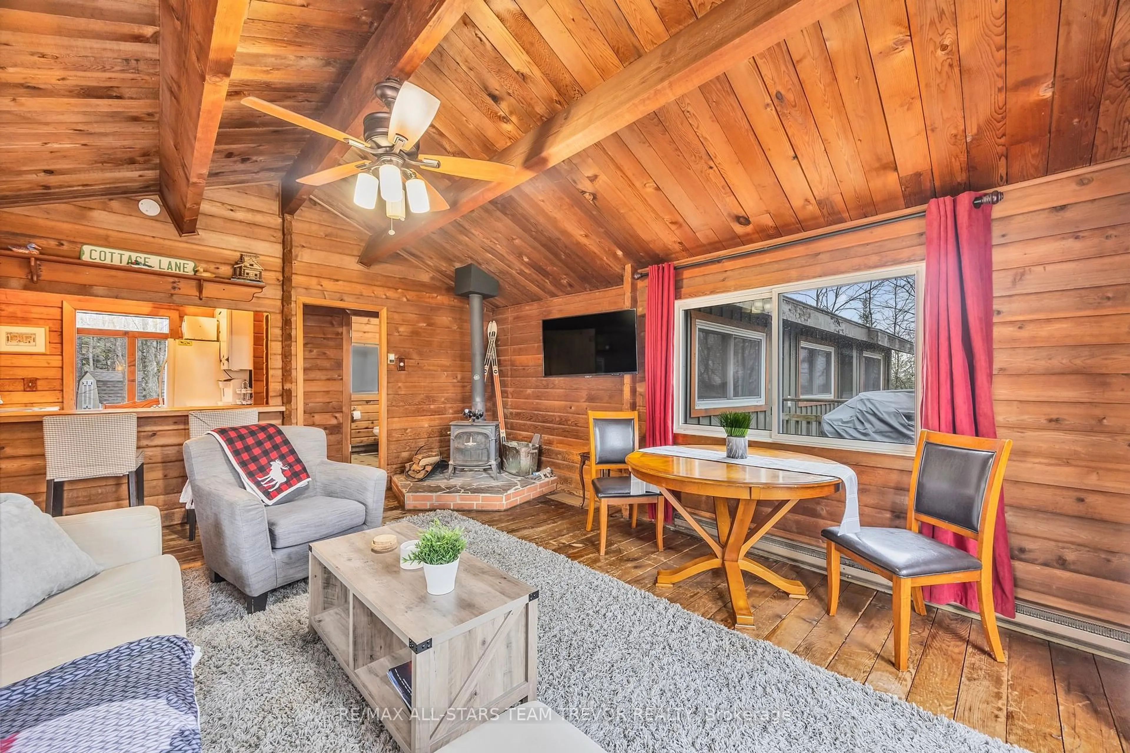 Living room with furniture, wood/laminate floor for 143 Chalet Cres, Huntsville Ontario P1H 1A8