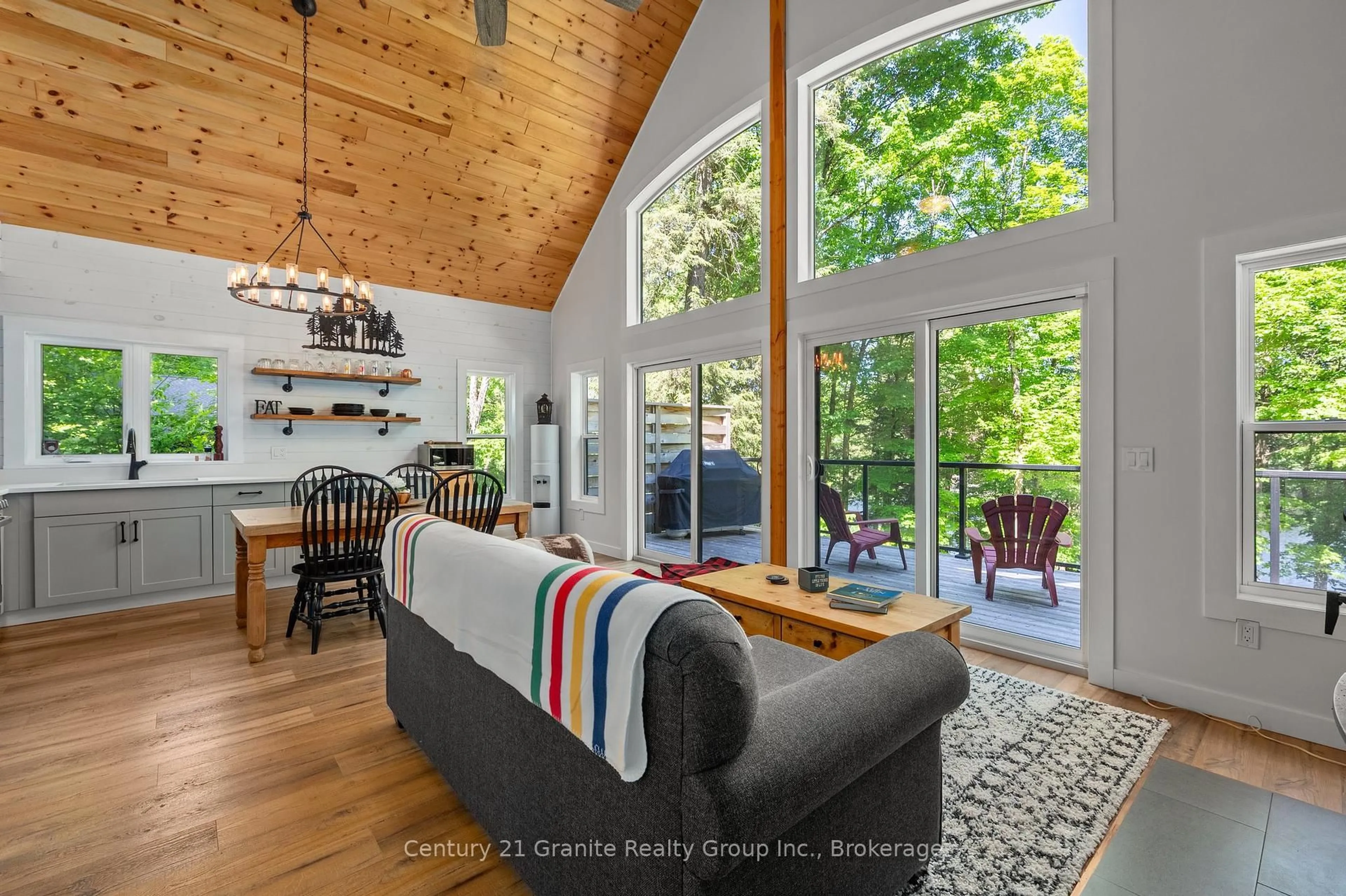 Living room with furniture, wood/laminate floor for 1577 RUGGED Lane, Algonquin Highlands Ontario K0M 2K0