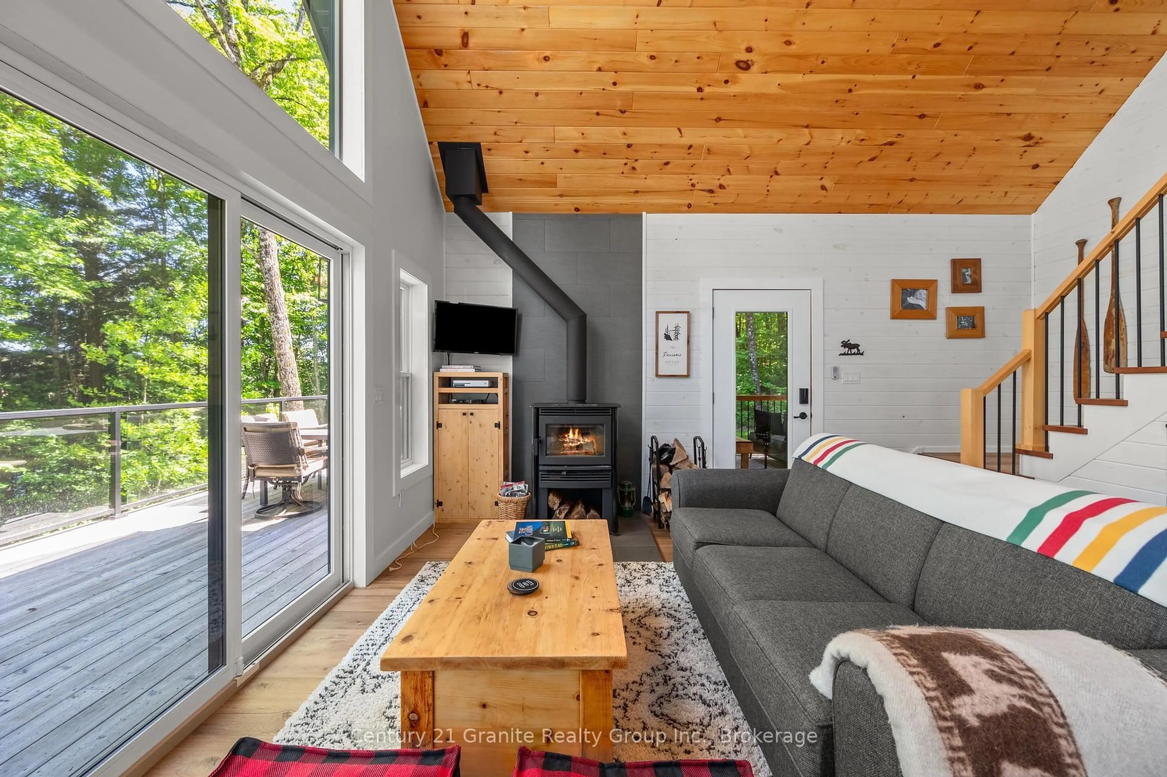 Living room with furniture, wood/laminate floor for 1577 RUGGED Lane, Algonquin Highlands Ontario K0M 2K0