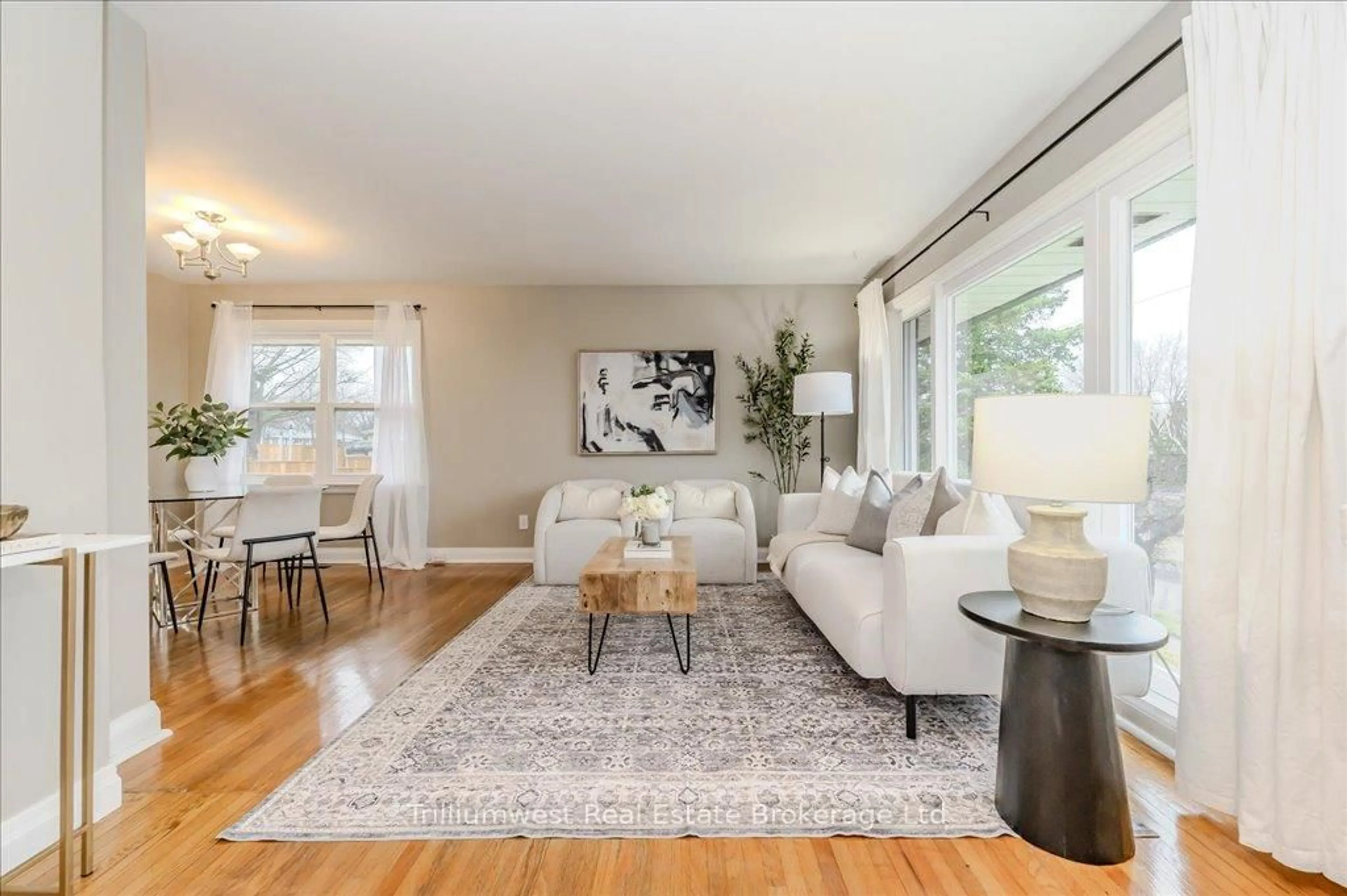 Living room with furniture, wood/laminate floor for 36 Rosewood Ave, Guelph Ontario N1H 5Z9