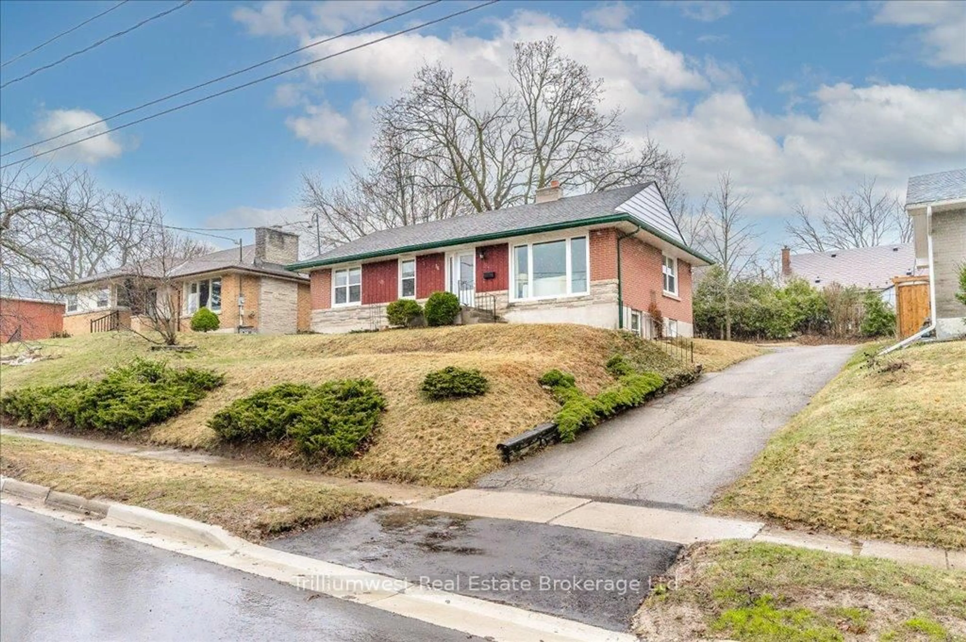 Home with brick exterior material, street for 36 Rosewood Ave, Guelph Ontario N1H 5Z9