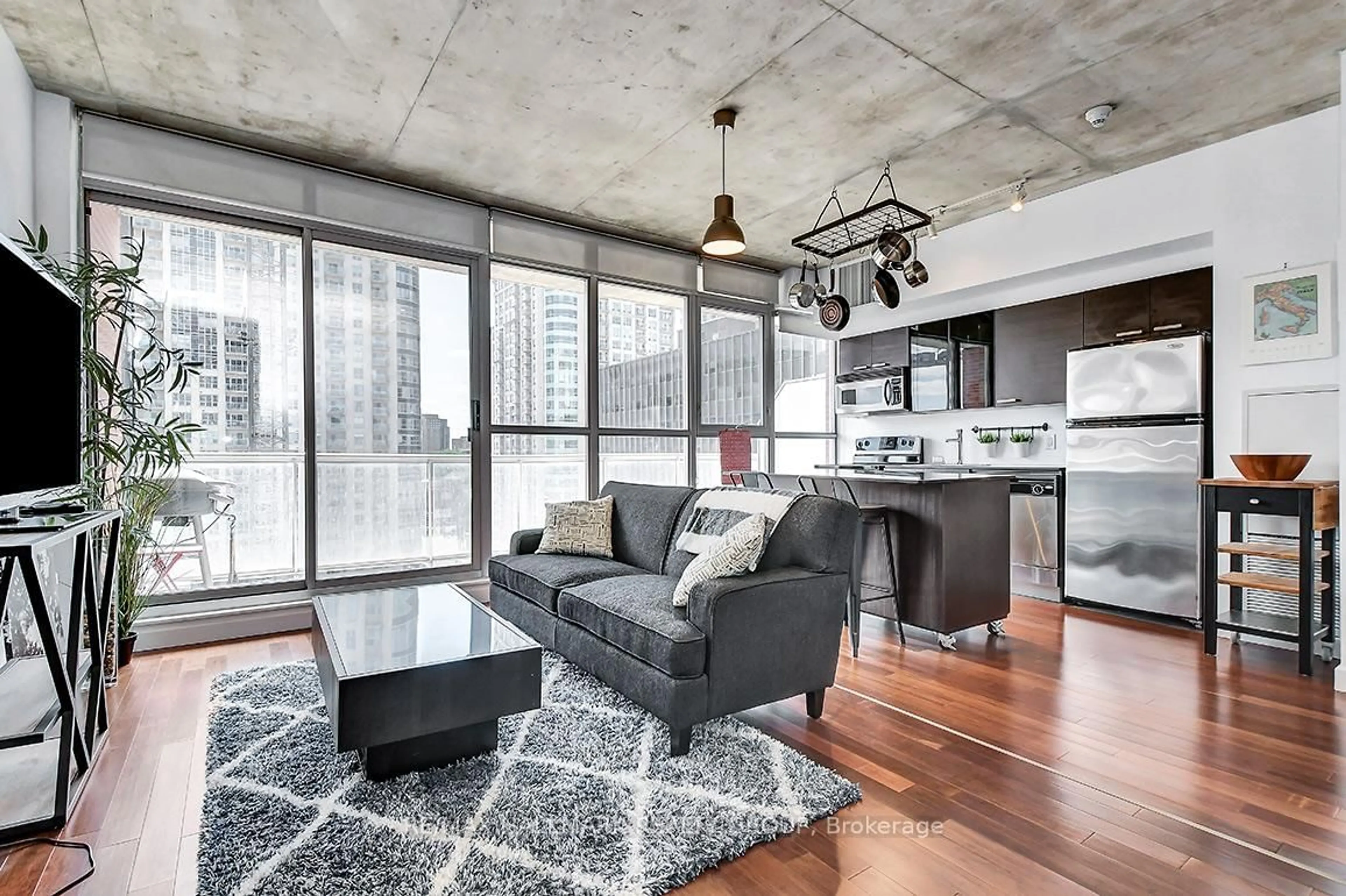 Living room with furniture, cement floor for 179 GEORGE St #1004, Ottawa Ontario K1N 1J8