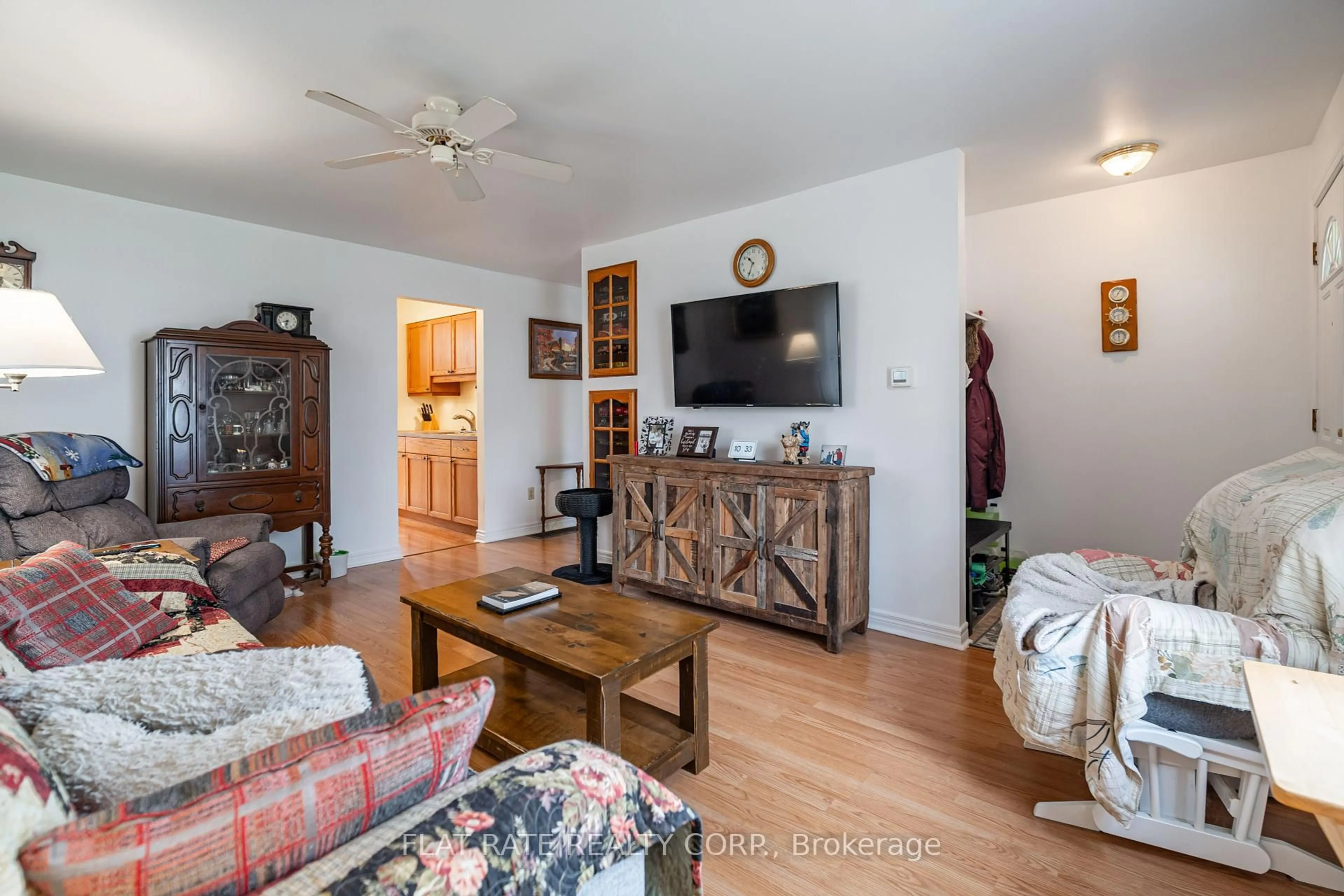 Living room with furniture, wood/laminate floor for 654 STORMONT St, Peterborough Ontario K9H 6A6