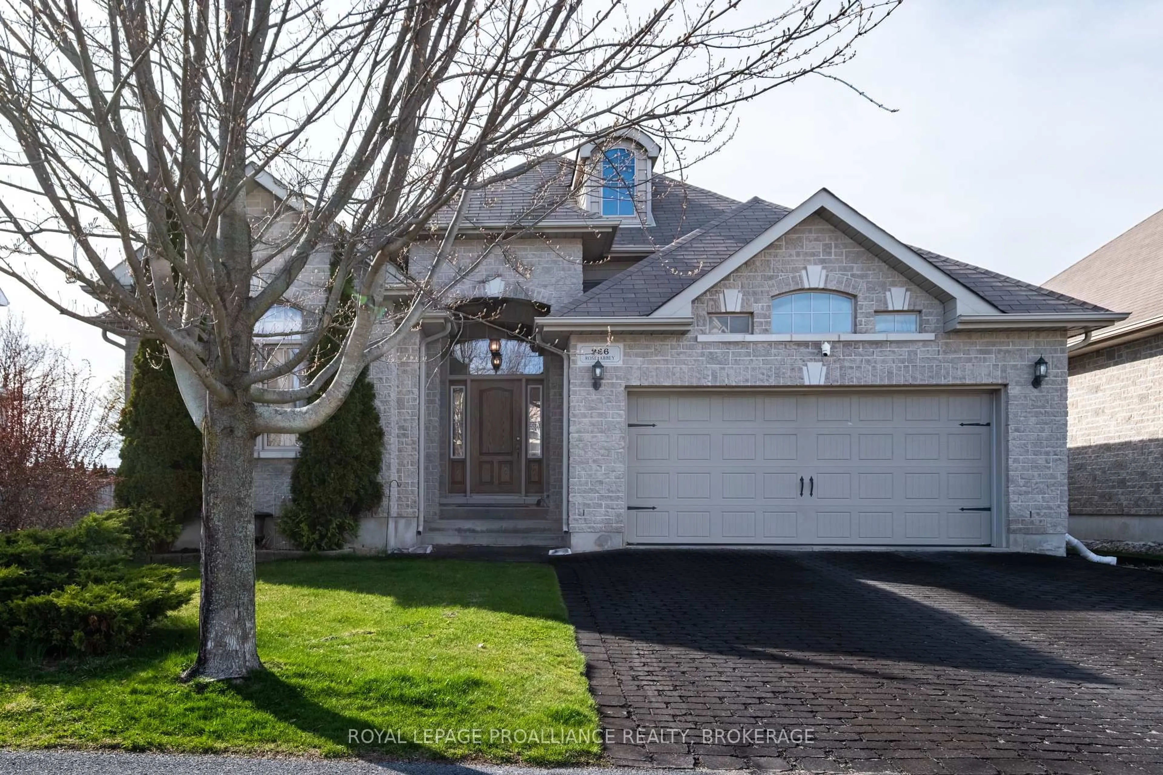 Home with vinyl exterior material, street for 226 Rose Abbey Dr, Kingston Ontario K7K 0A2
