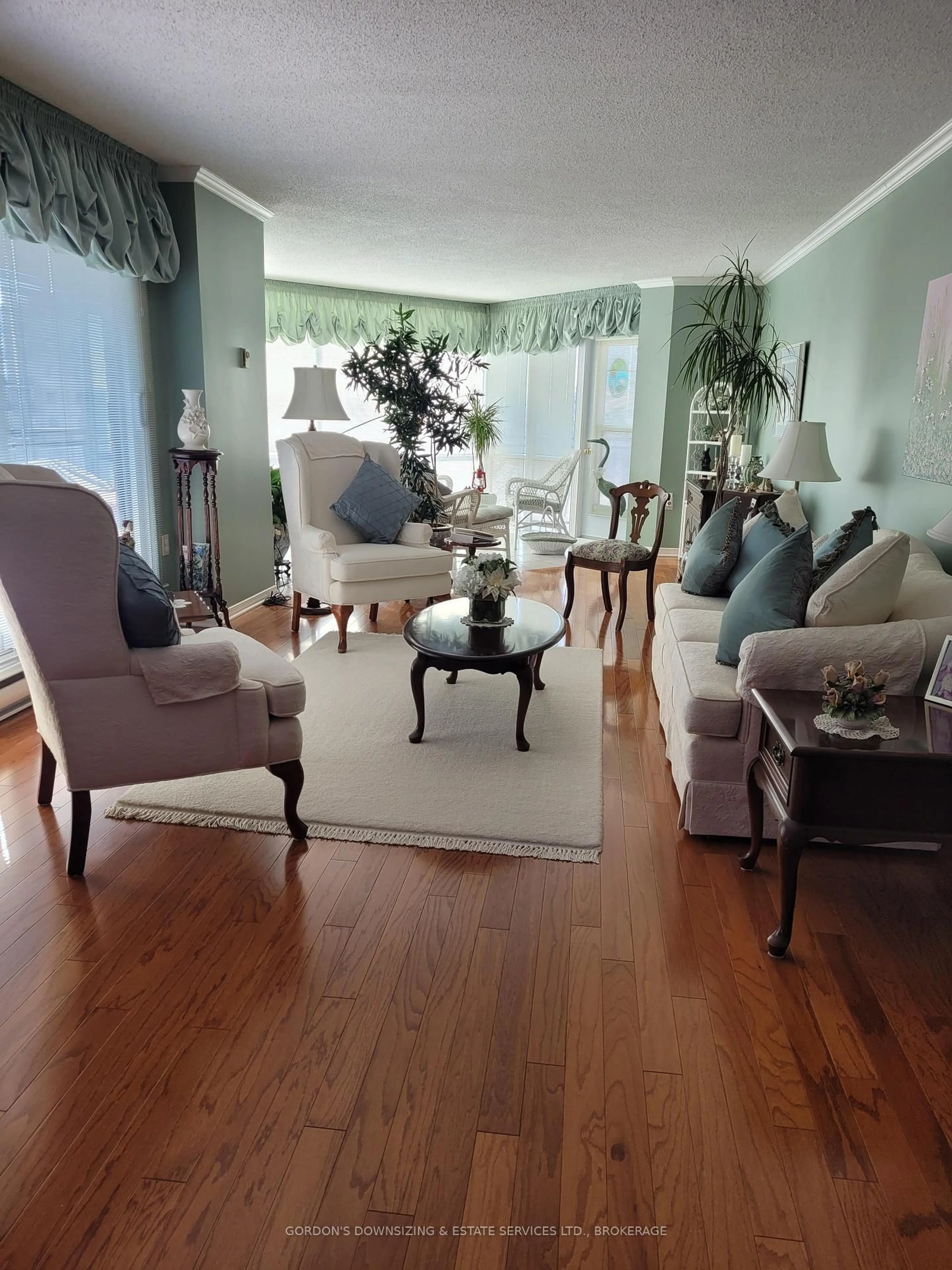 Living room with furniture, wood/laminate floor for 115 Barrett Crt #606, Kingston Ontario K7L 5H6