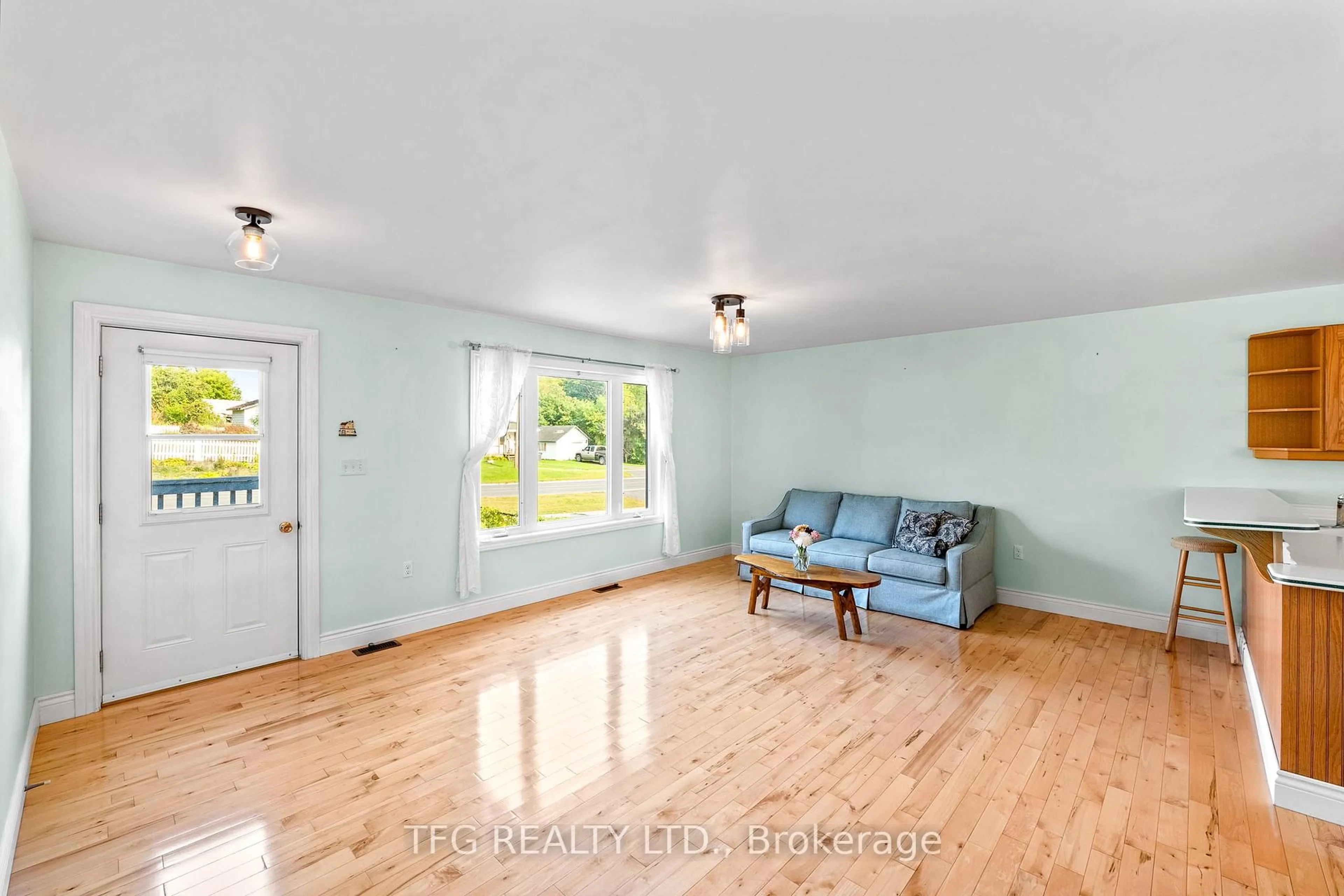 Living room with furniture, wood/laminate floor for 39 O'Brien St, Limoges Ontario K0K 2M0