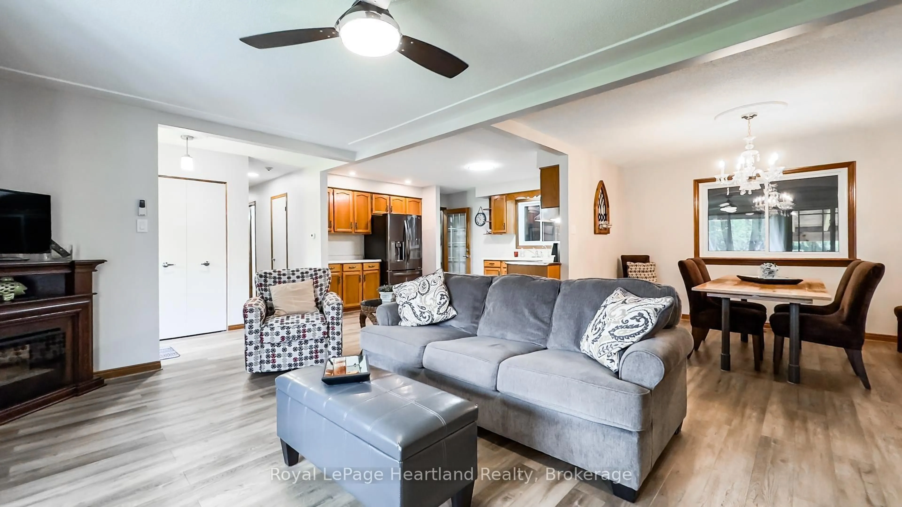 Living room with furniture, wood/laminate floor for 33980 Moore Crt, Bluewater Ontario N0M 2T0