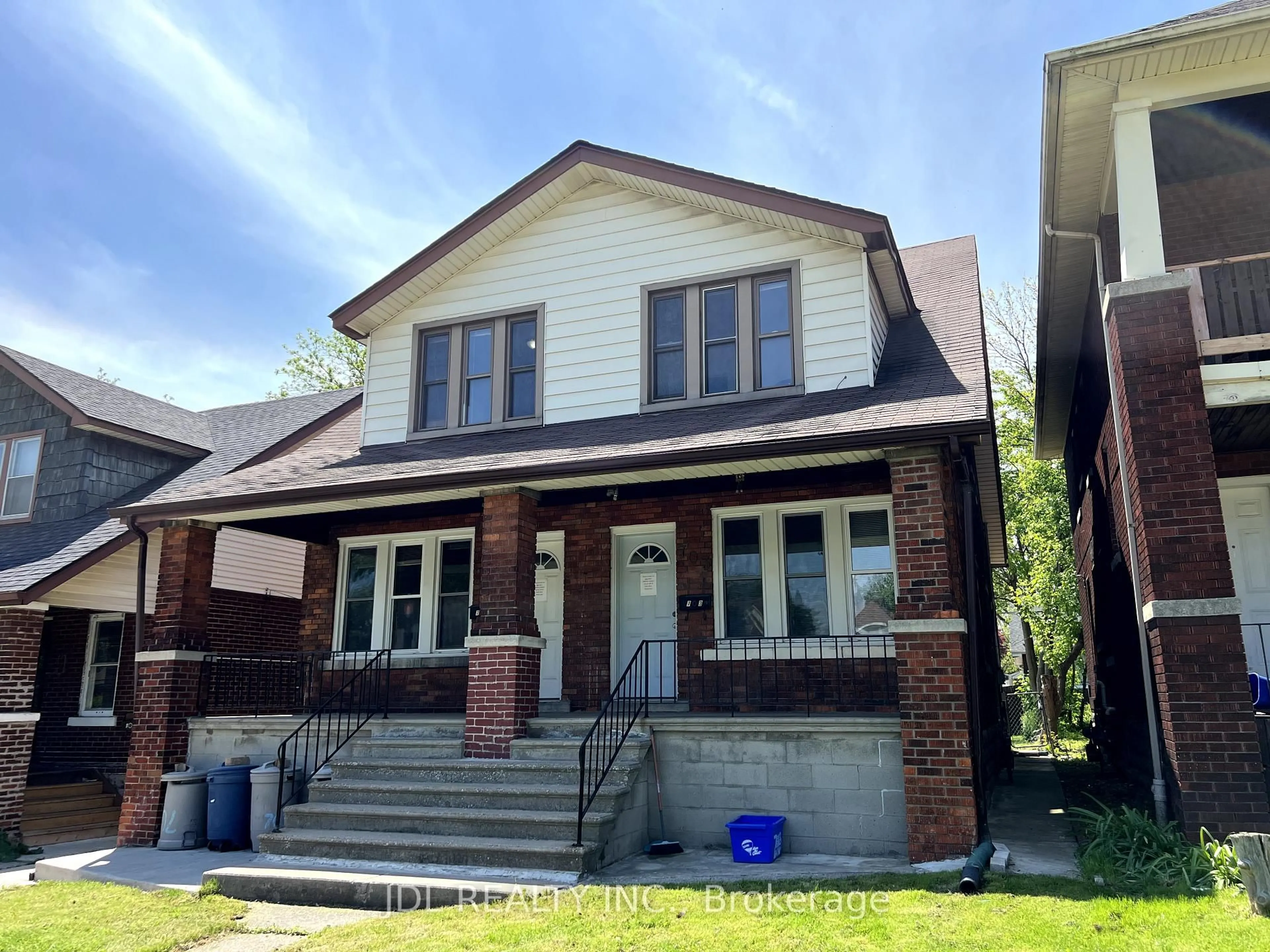 Home with brick exterior material, street for 703-705 Partington Ave, Windsor Ontario N9B 2N6