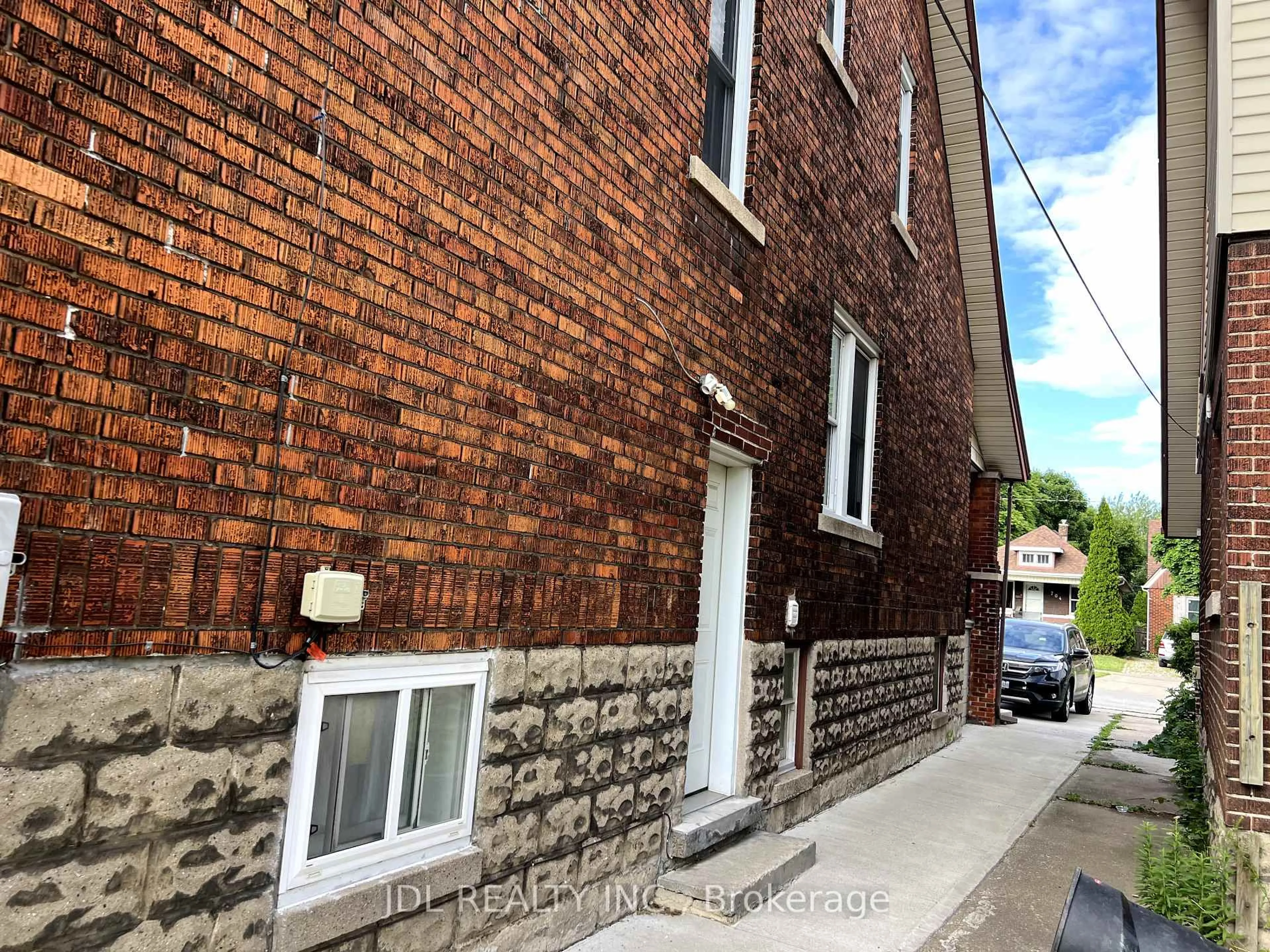Home with brick exterior material, street for 703-705 Partington Ave, Windsor Ontario N9B 2N6
