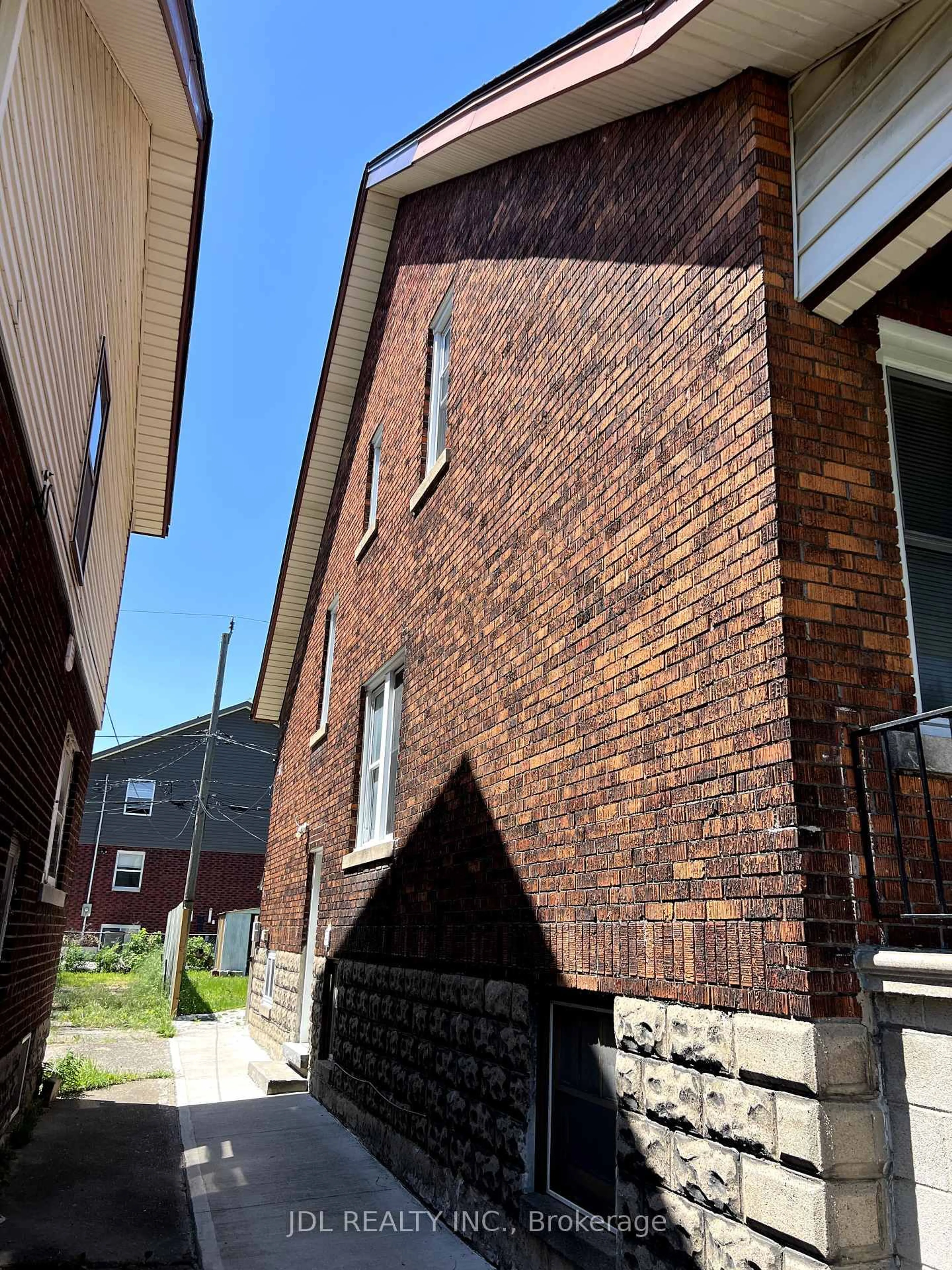 Home with brick exterior material, street for 703-705 Partington Ave, Windsor Ontario N9B 2N6