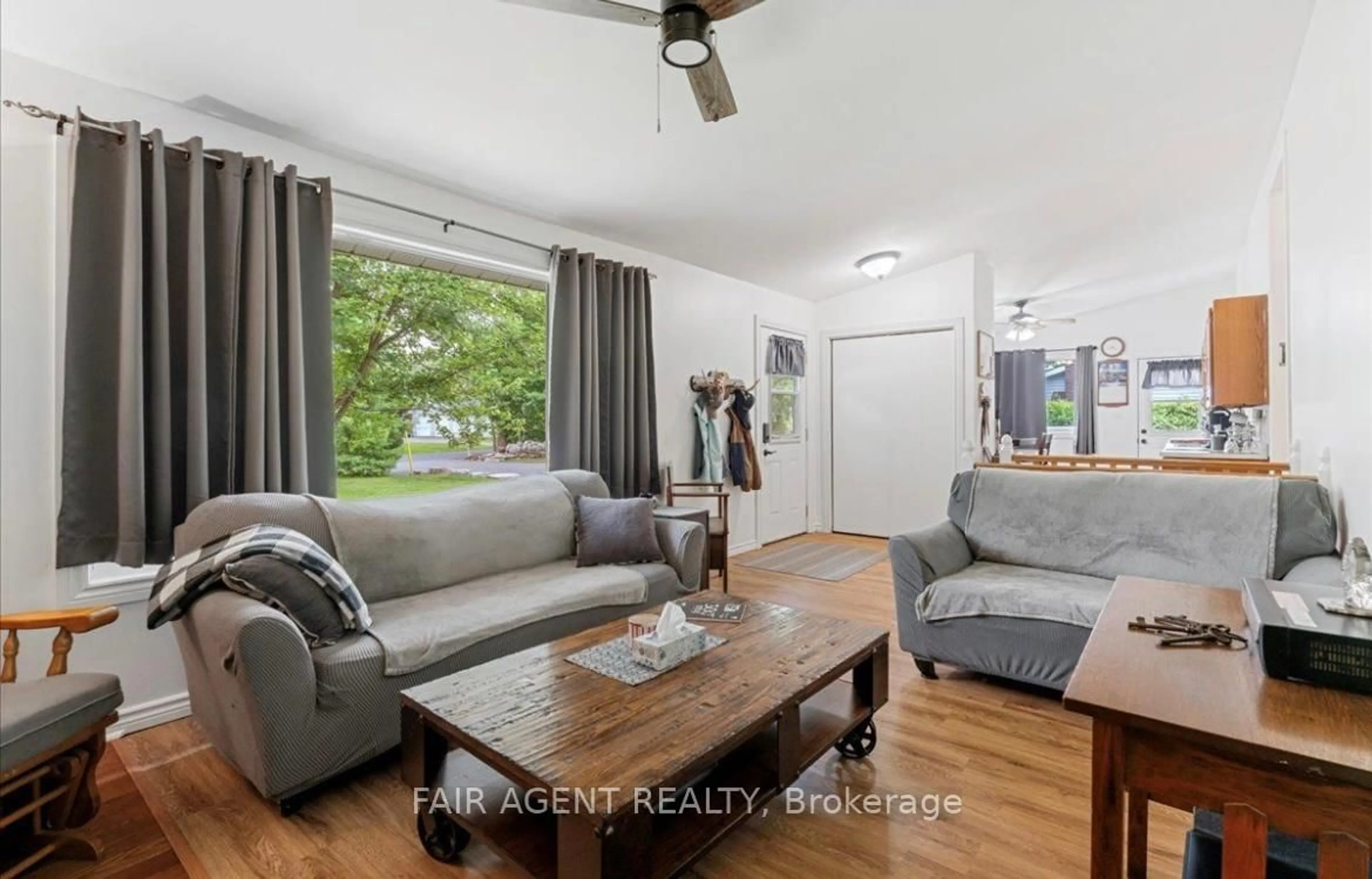 Living room with furniture, wood/laminate floor for 69 Booster Park Rd, Limoges Ontario K0K 2M0