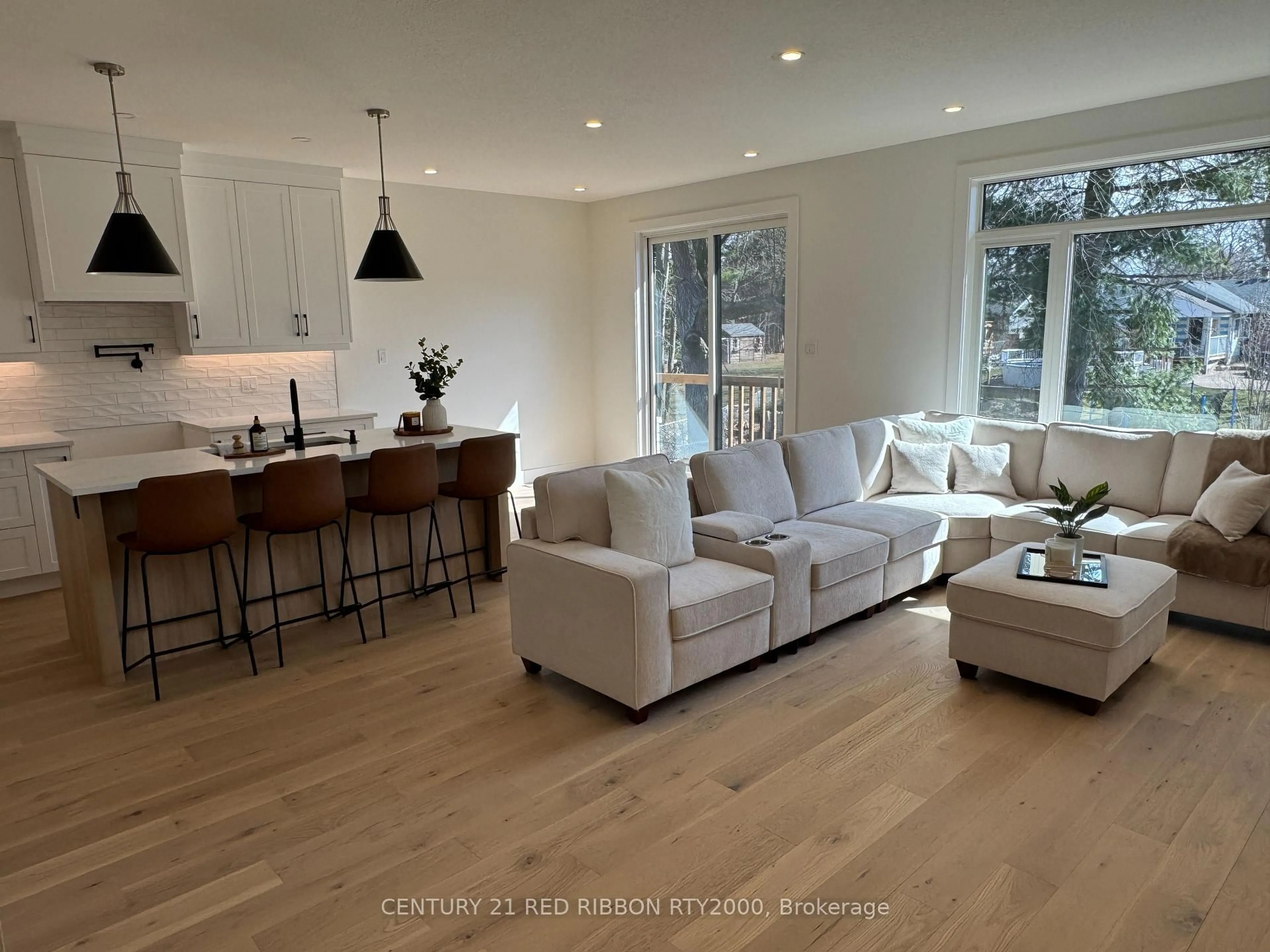 Living room with furniture, wood/laminate floor for 430 Head St #26, Strathroy Caradoc Ontario N7G 2K2