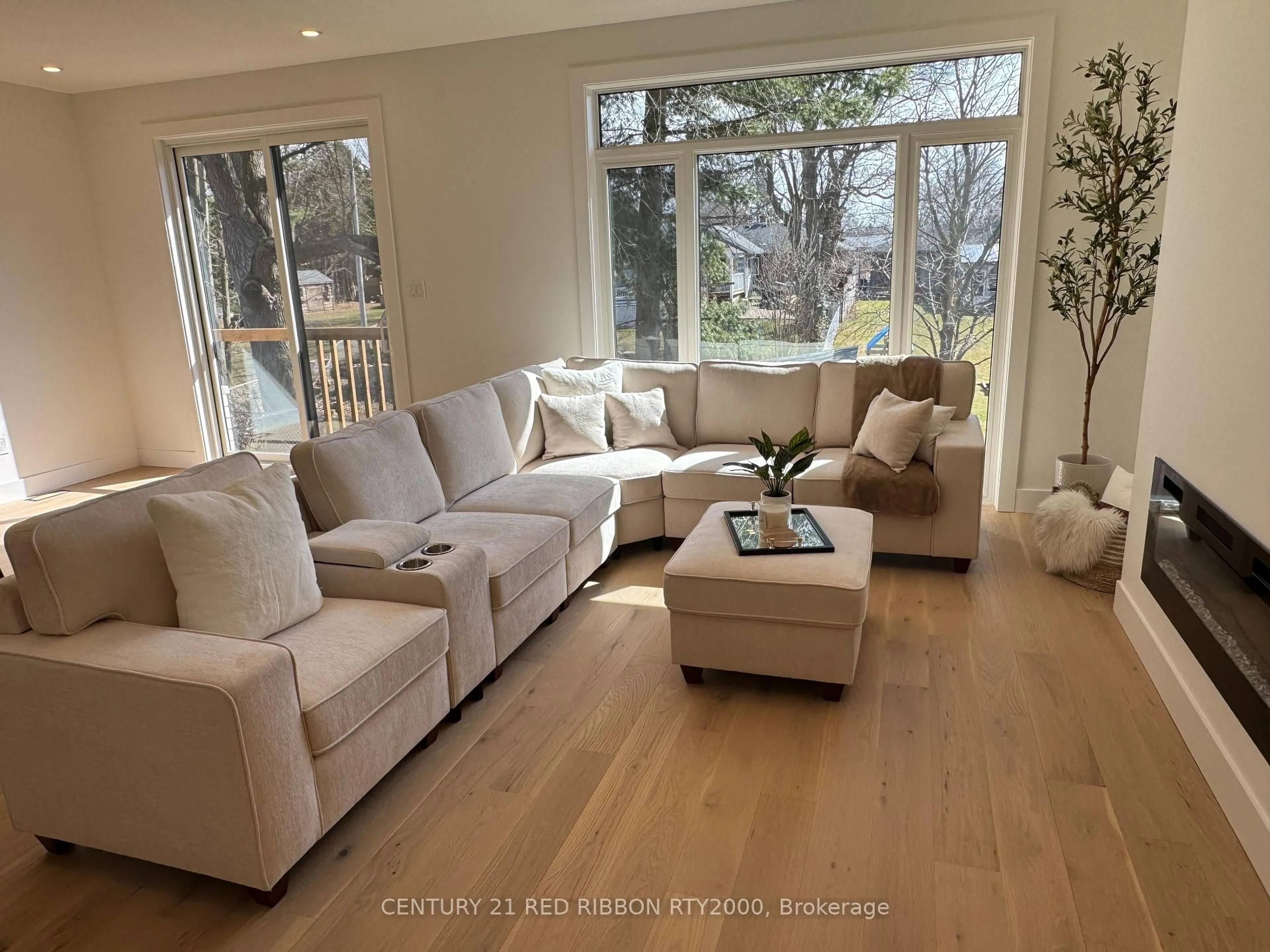 Living room with furniture, wood/laminate floor for 430 Head St #26, Strathroy Caradoc Ontario N7G 2K2