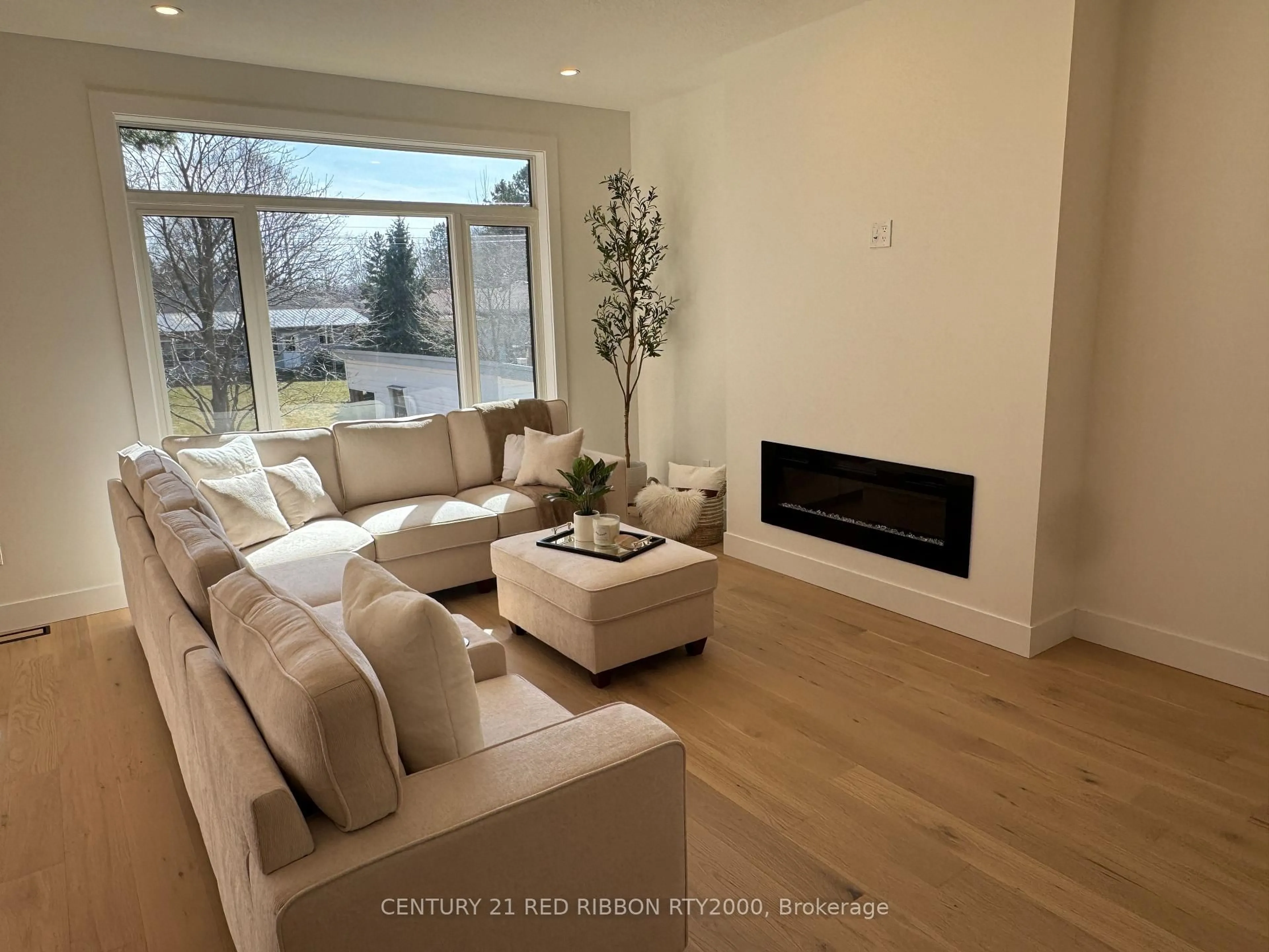 Living room with furniture, wood/laminate floor for 430 Head St #26, Strathroy Caradoc Ontario N7G 2K2