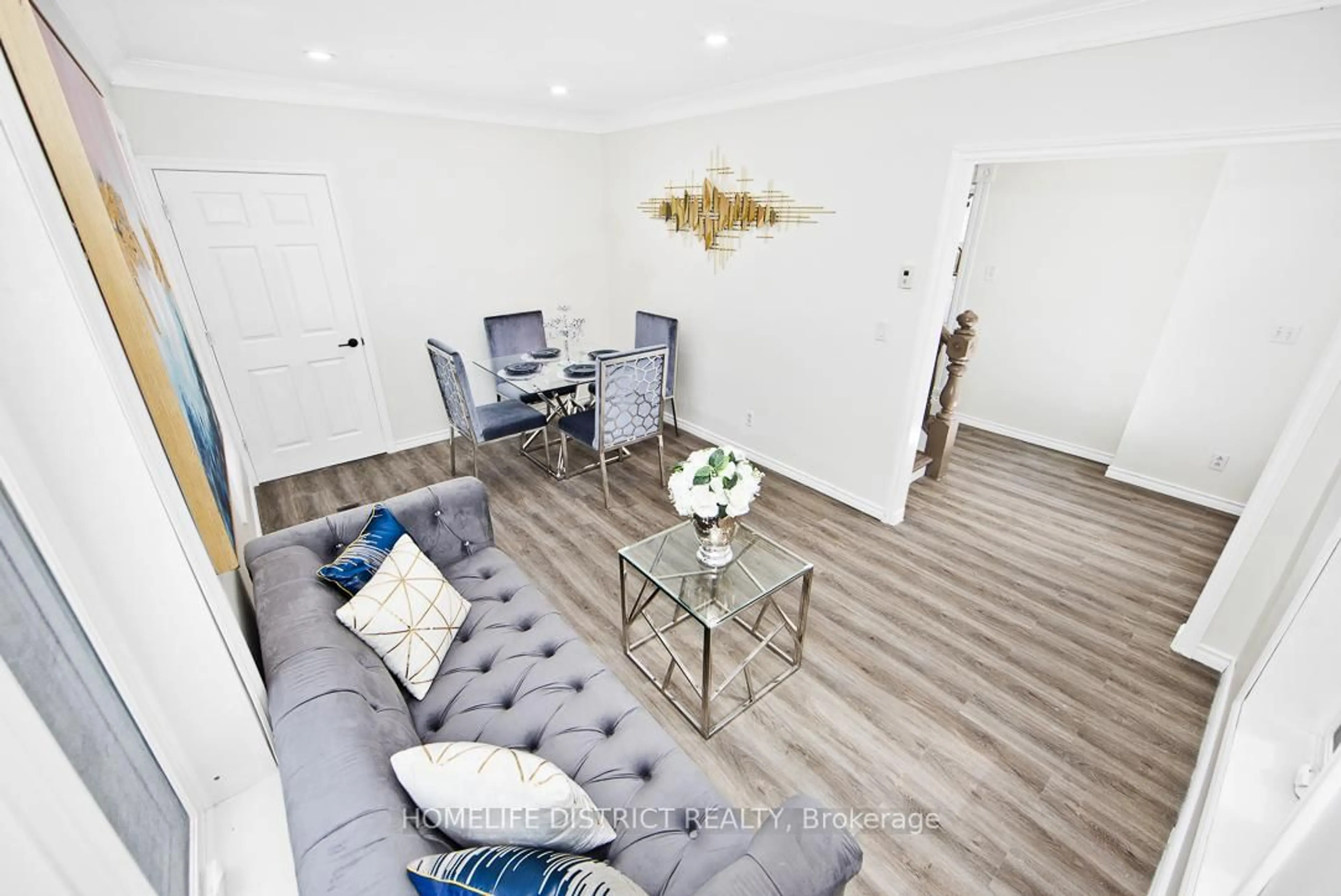 Living room with furniture, wood/laminate floor for 84 Forsyth St, Limoges Ontario K0K 2M0